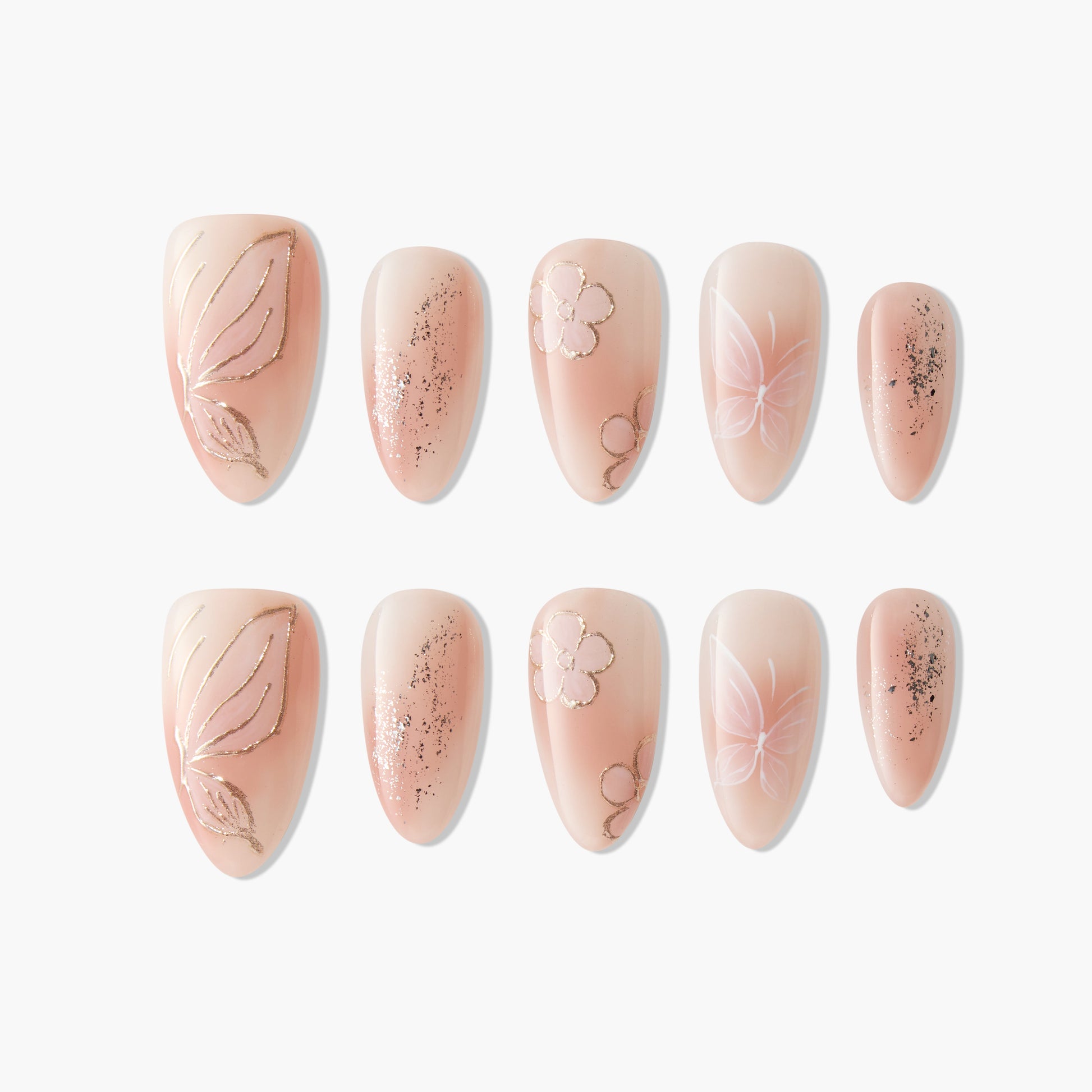 Handmade press-on nails with nude base, floral and butterfly designs, and gold glitter accents.