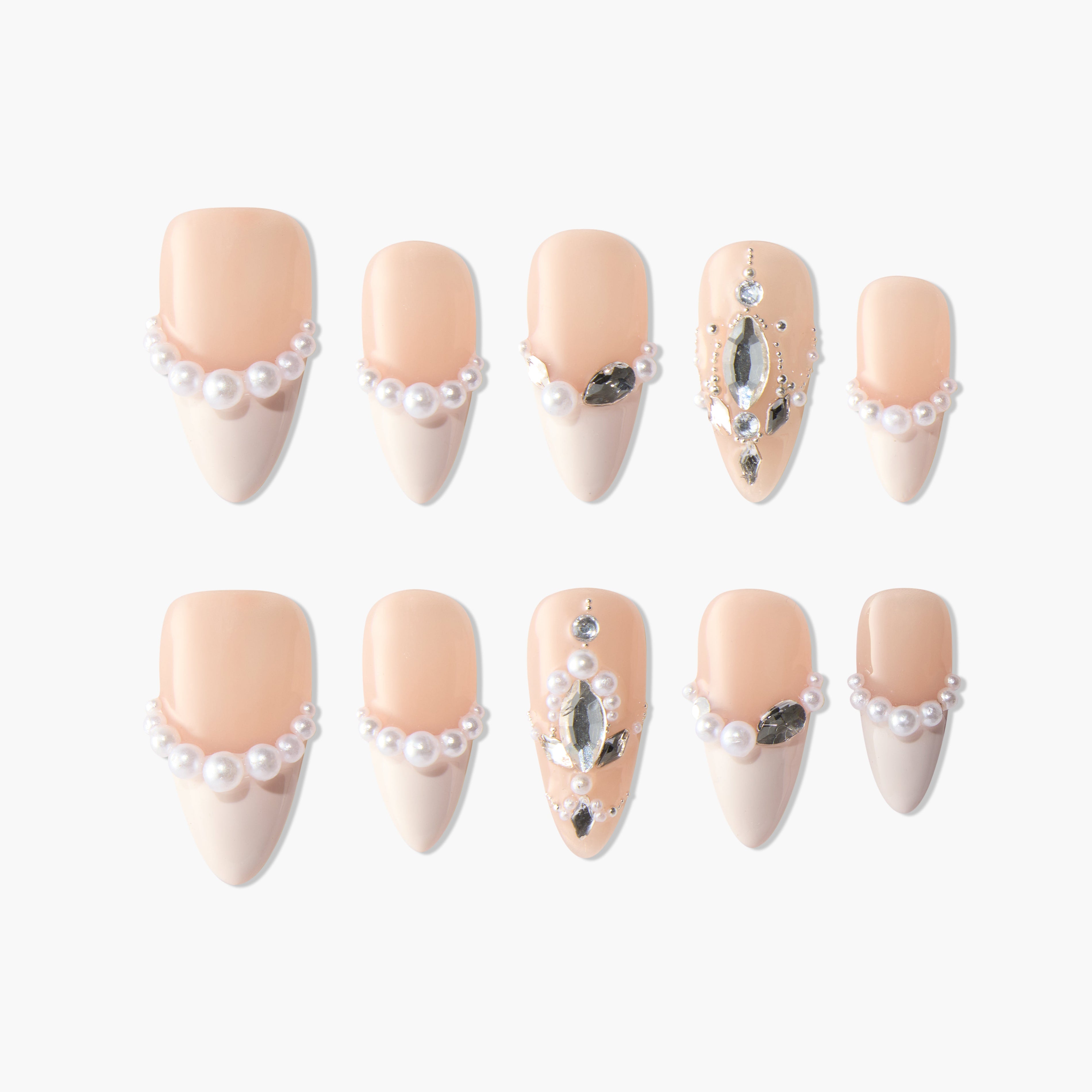 Handmade press-on nails with nude and white French tips, pearl accents, and rhinestone jewels.