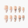 Handmade press-on nails with nude and white French tips, pearl accents, and rhinestone jewels.