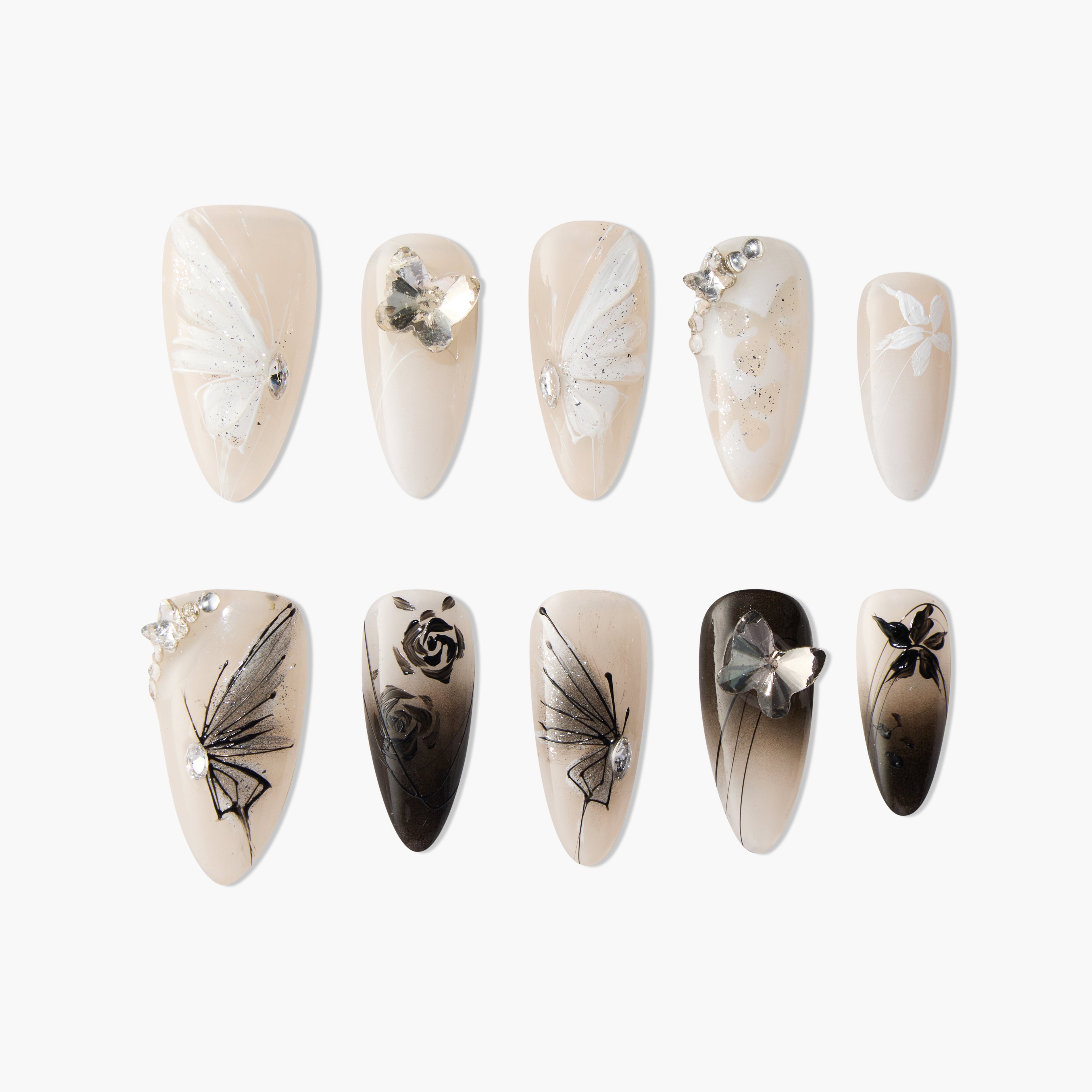 Handmade press-on nails set with nude base, butterfly, flower, and rhinestone designs