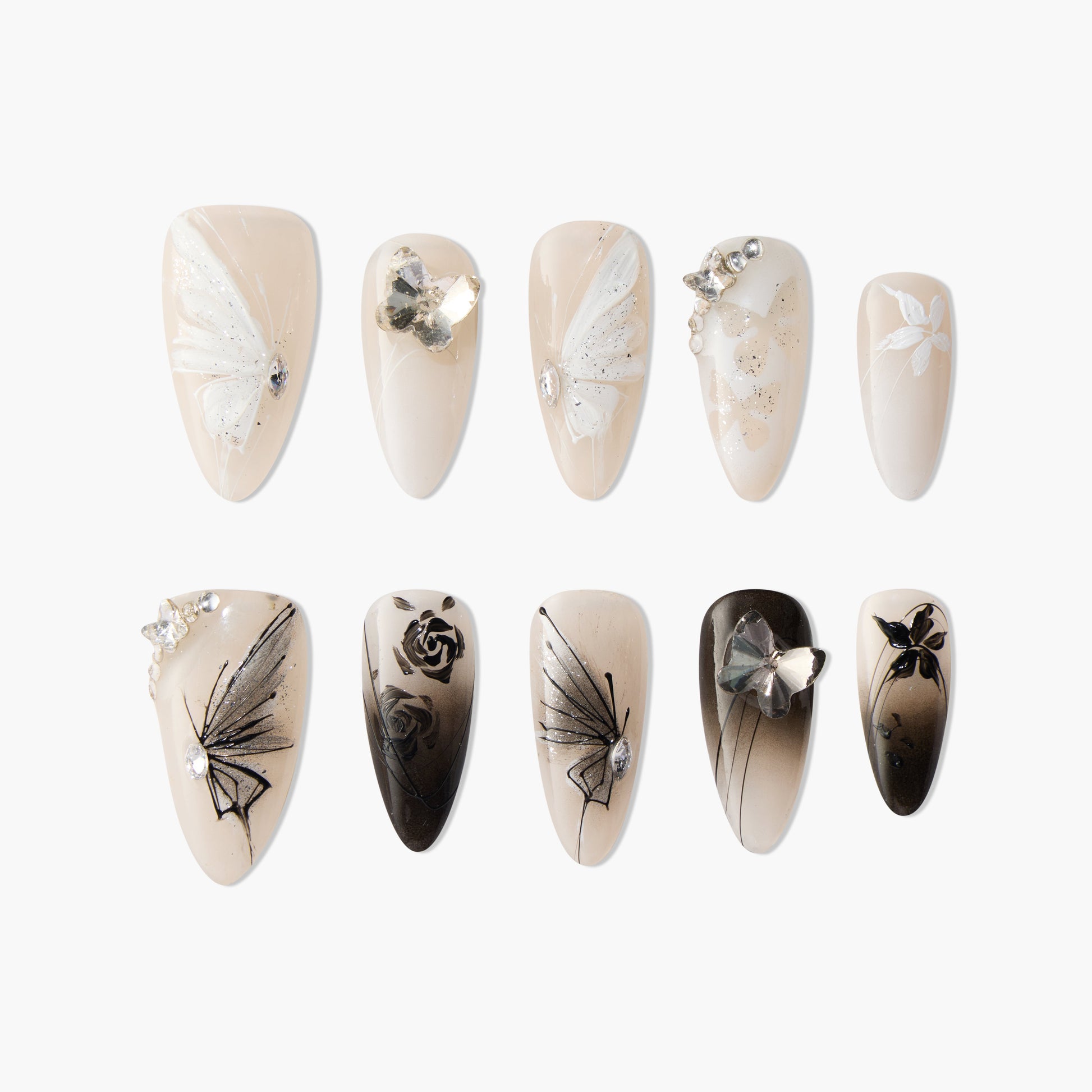 Handmade press-on nails set with nude base, butterfly, flower, and rhinestone designs