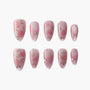 Handmade pink press-on nails with floral rose designs and subtle rhinestone accents