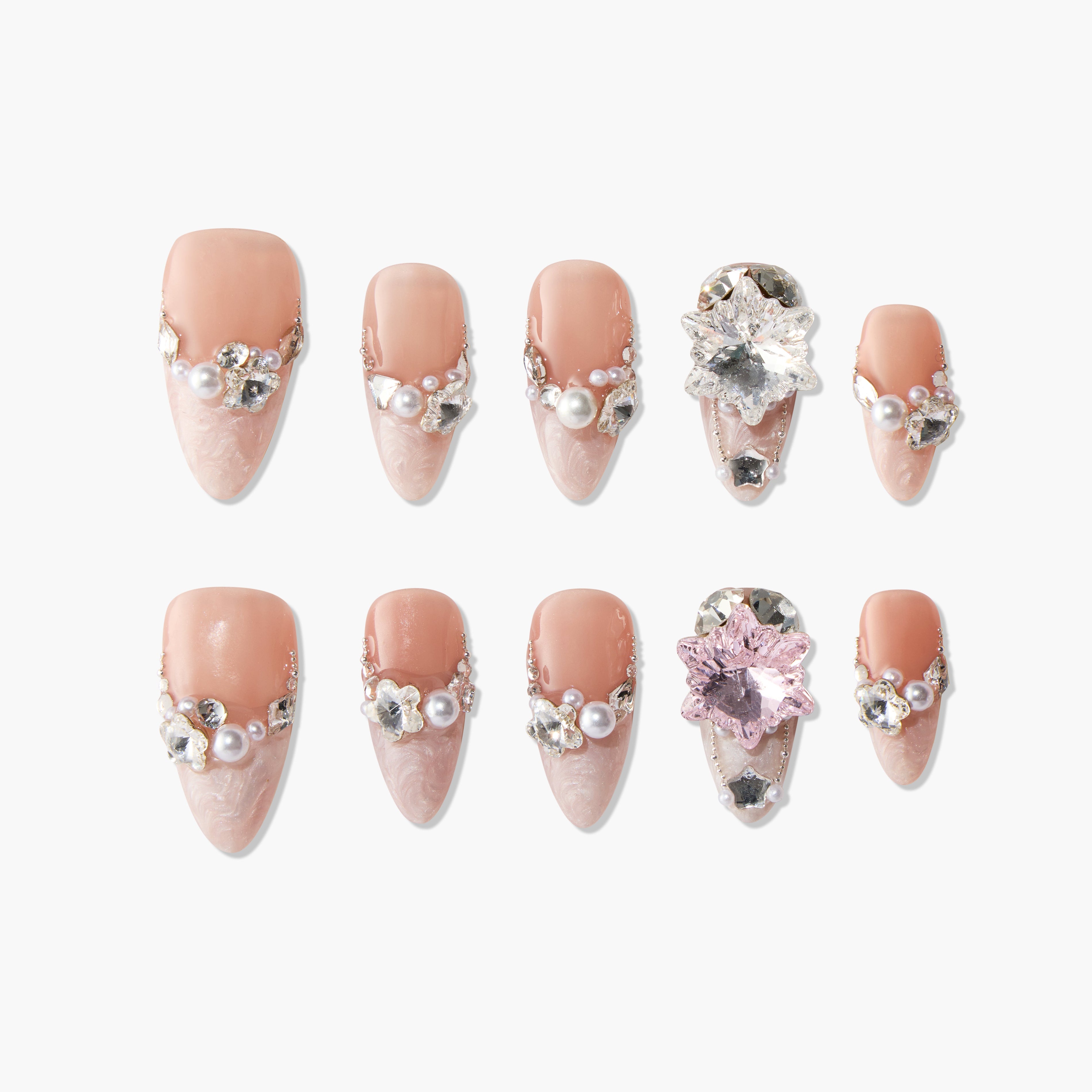 Handmade press-on nails with pink marbled tips, pearl accents, rhinestones, and 3D floral gems