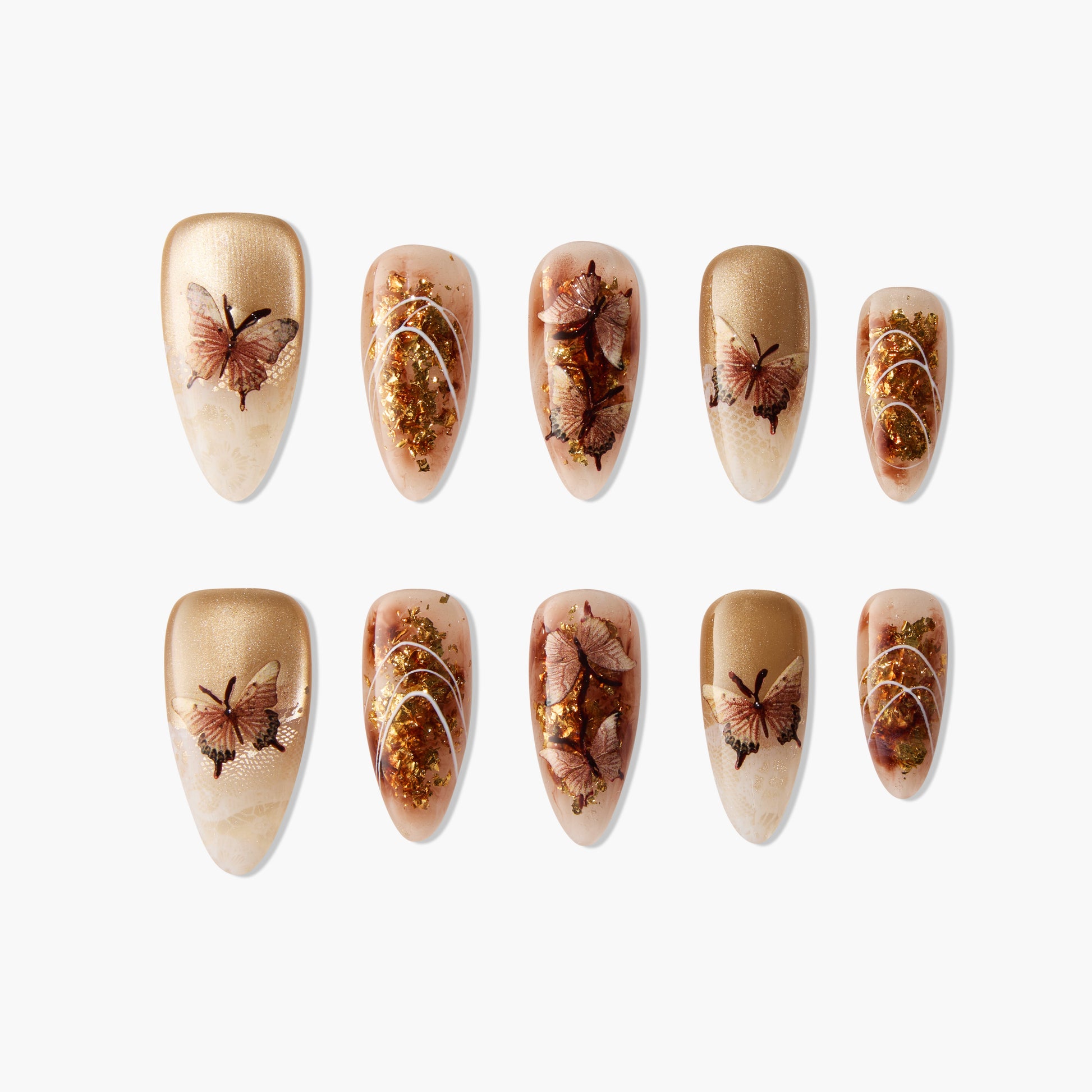 Handmade press-on nails with gold glitter, brown butterfly accents, and beige ombre design.