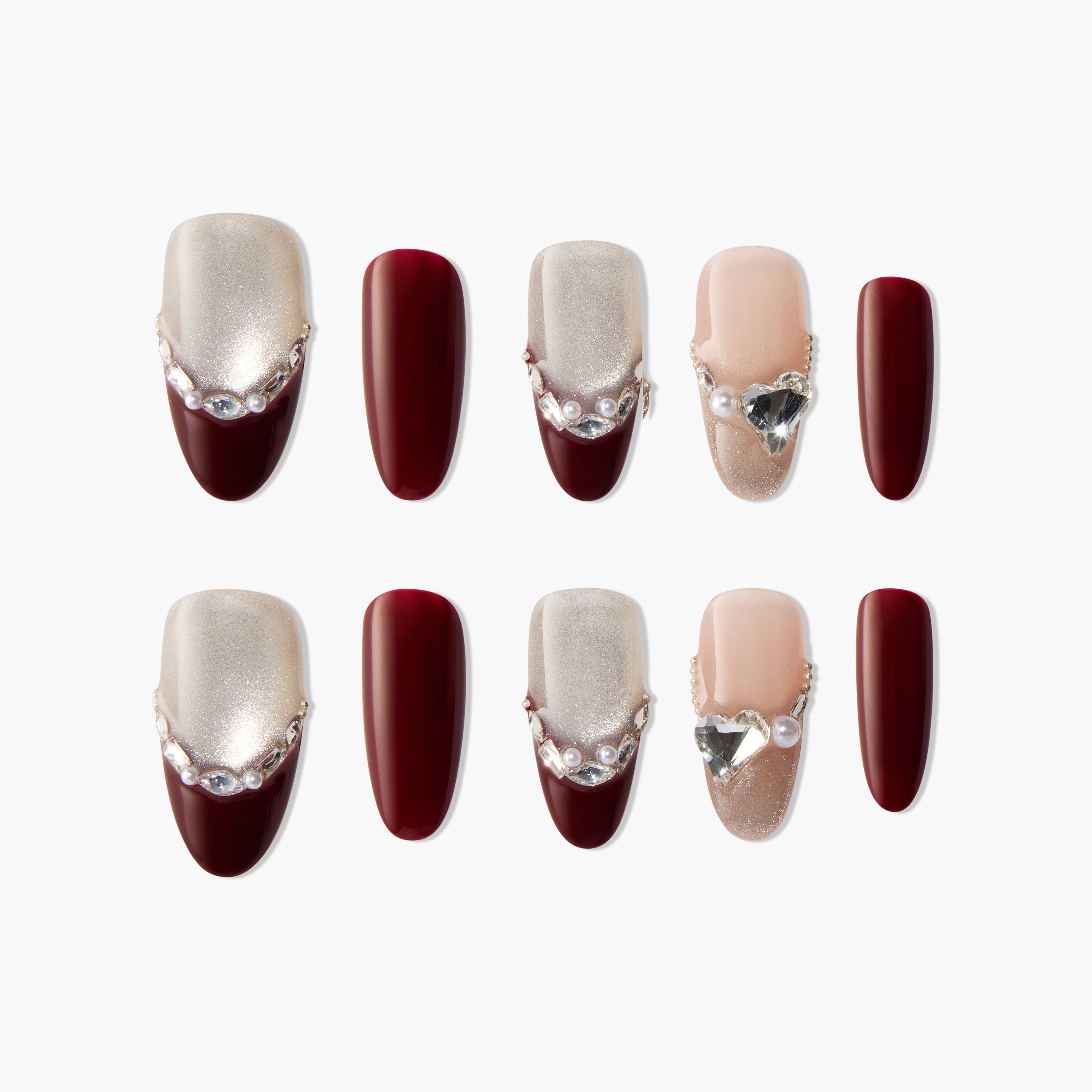 Handmade press-on nails set with burgundy, shimmer accents, pearls, and crystal heart charms