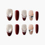 Handmade press-on nails set with burgundy, shimmer accents, pearls, and crystal heart charms