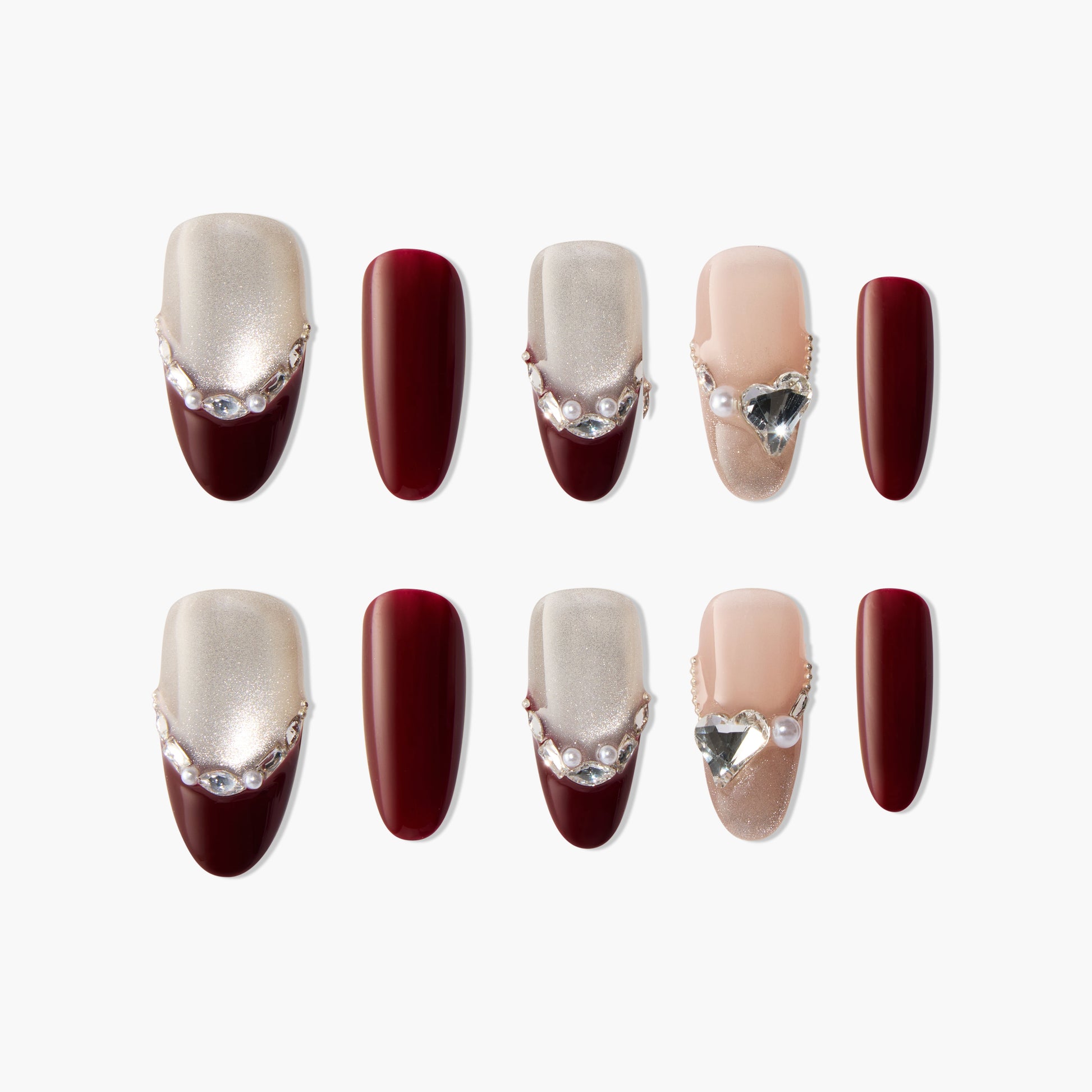 Handmade press-on nails set with burgundy, shimmer accents, pearls, and crystal heart charms