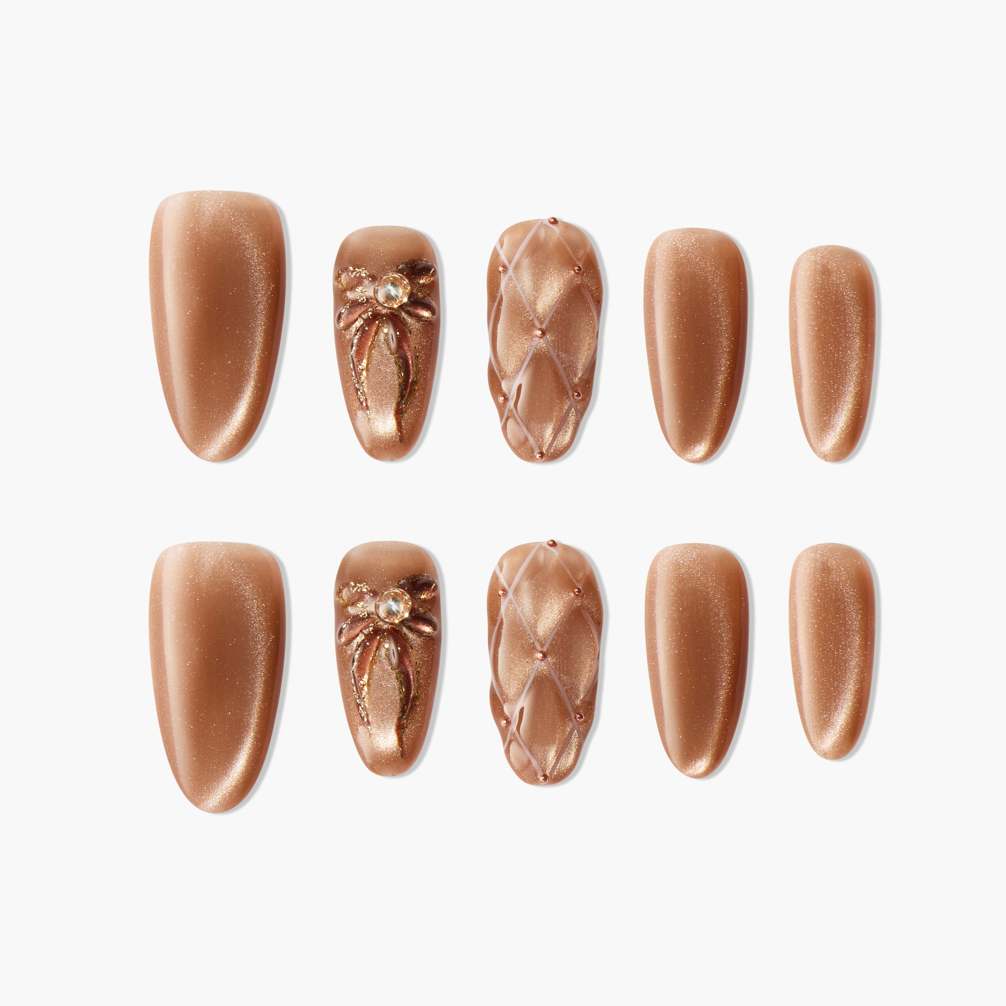 Set of brown press-on nails with shimmer, quilted texture, and bow gem accents arranged on white background