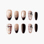 Handmade press-on nails in nude and dark brown with rhinestones, bows, and plaid accents.