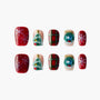 Handmade press-on nails with Christmas designs, including snowflakes, plaid, tree, and ornament arts.