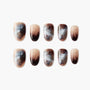Handmade press-on nails with brown, nude, and blue marble design and subtle glitter accents