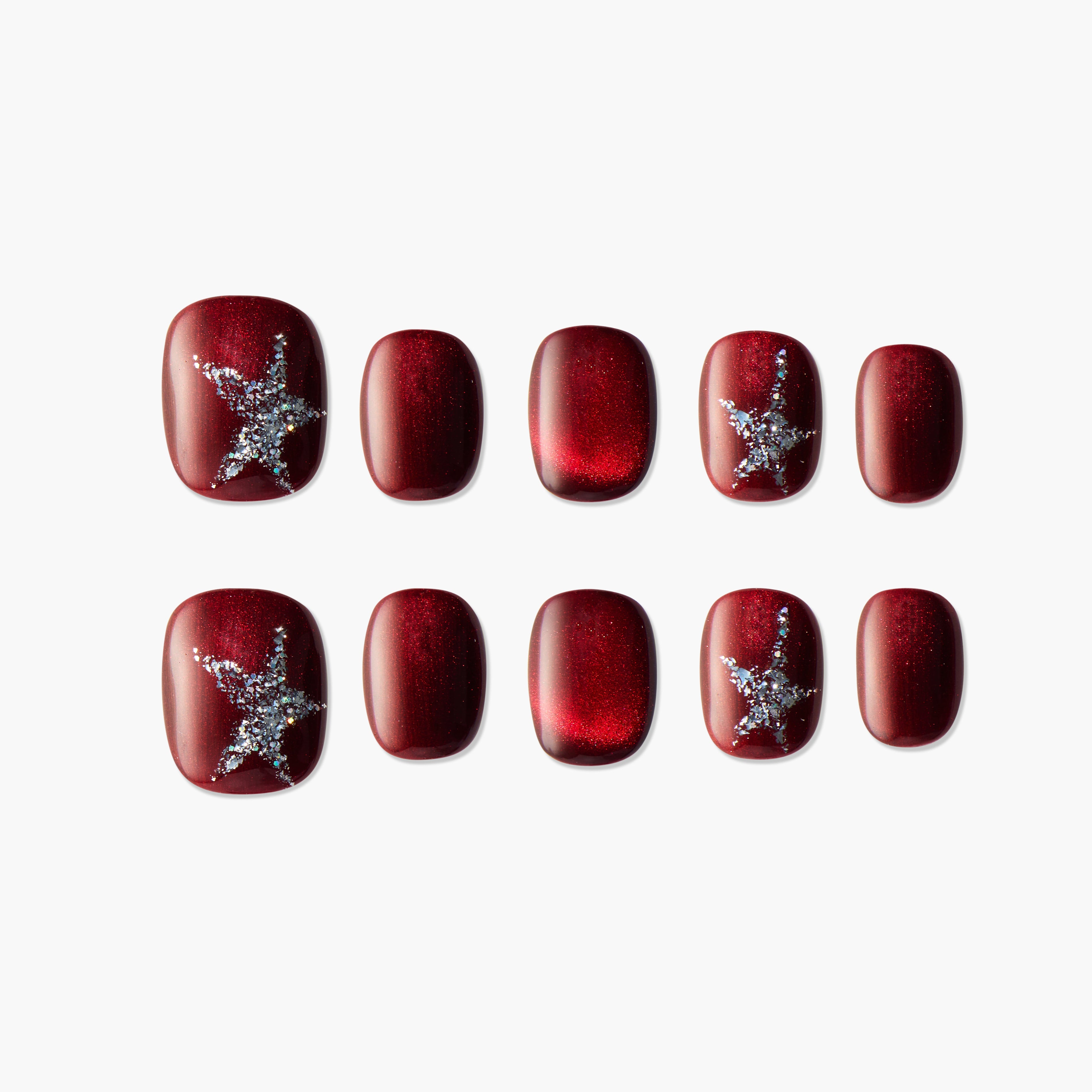 Red press-on nails set featuring glitter starfish designs and glossy finish on a white background.