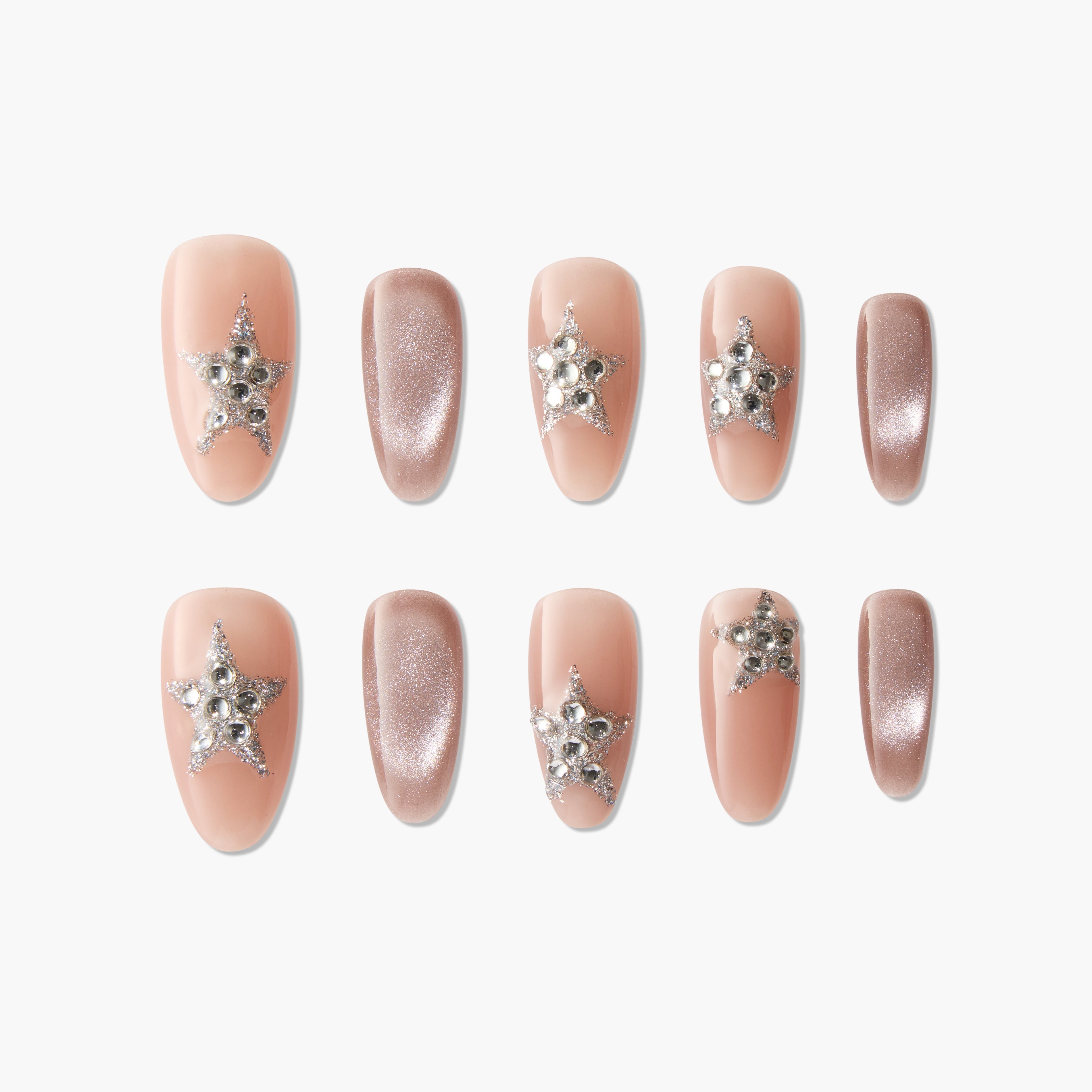 Handmade press-on nails in nude and glitter pink with rhinestone star accents, elegant design