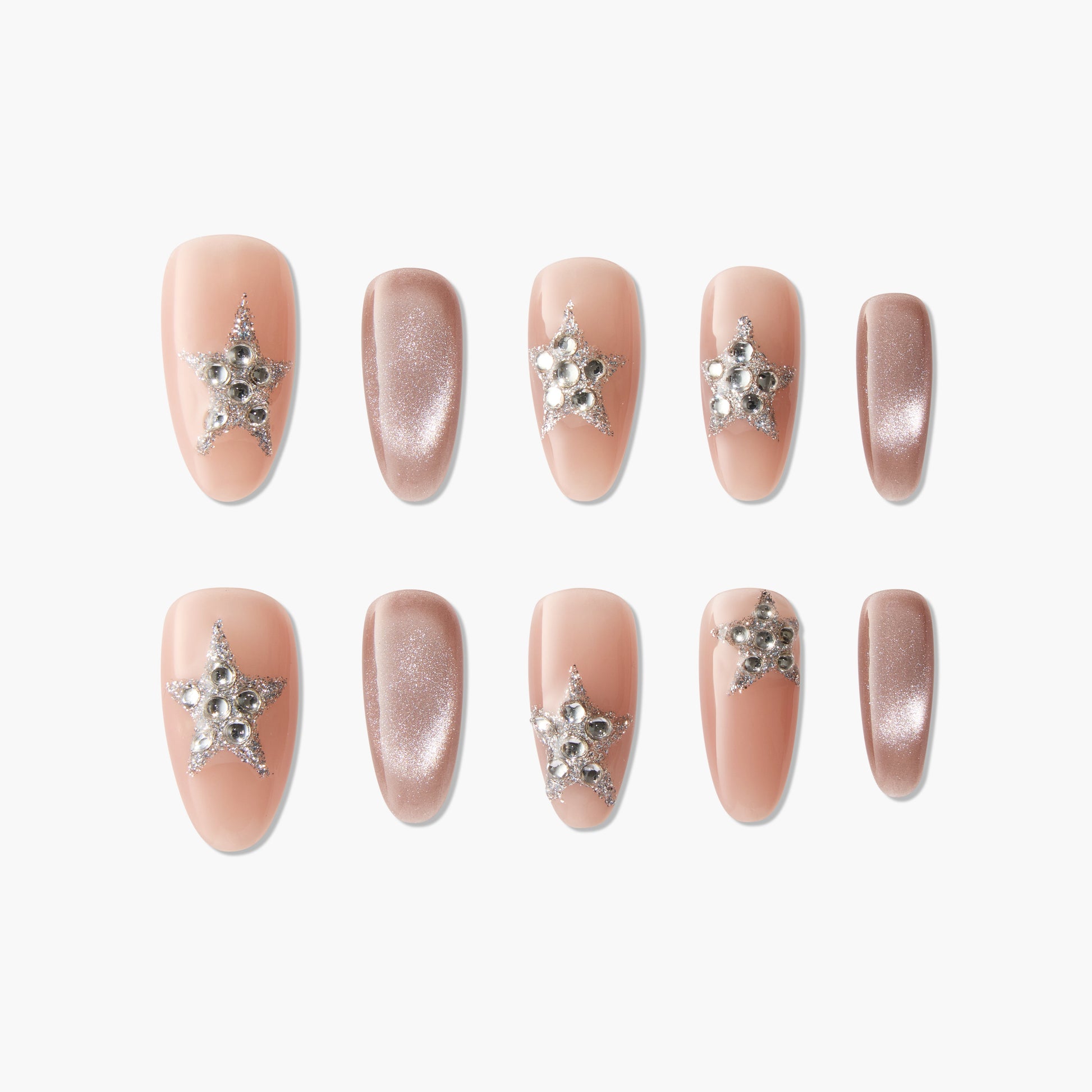 Handmade press-on nails in nude and glitter pink with rhinestone star accents, elegant design
