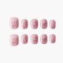 Pink glitter press-on nails with butterfly designs, salon-quality reusable nail set