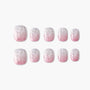 Set of pink and white ombre press-on nails with glitter and marble effect on white background