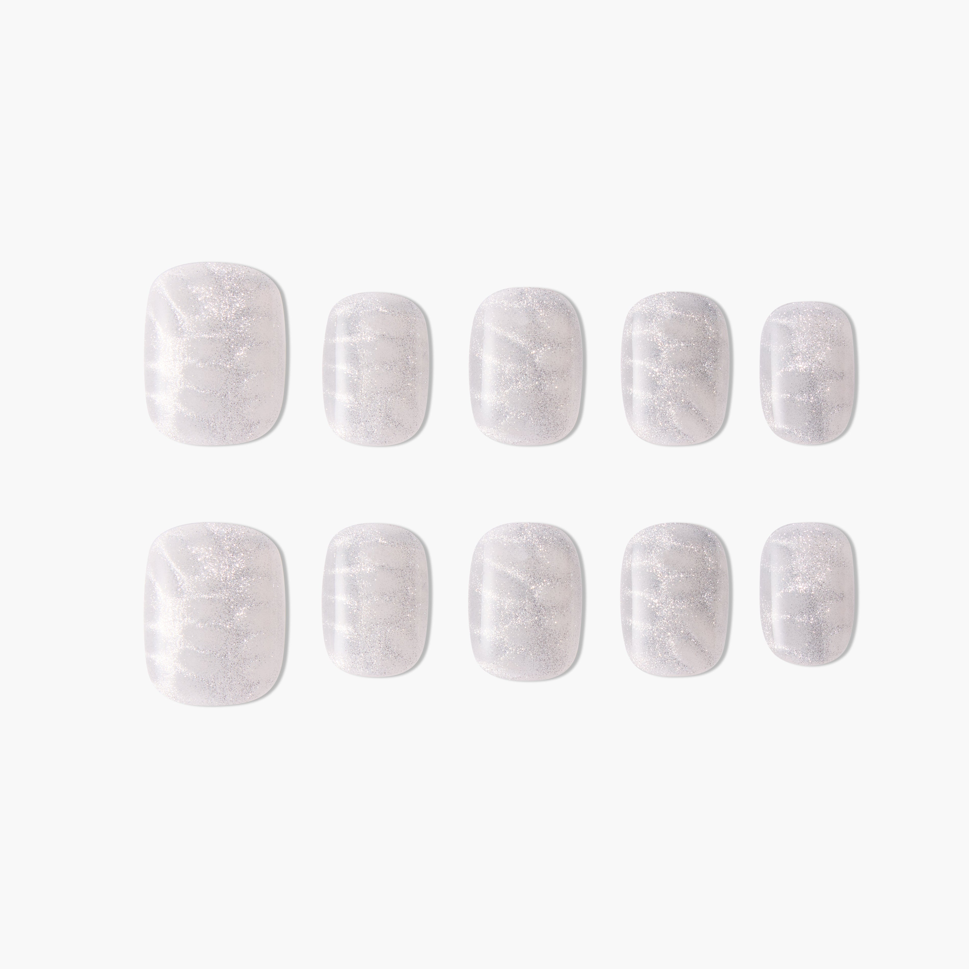 Set of press-on nails with a shimmery white marble design on a plain background
