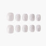 Set of press-on nails with a shimmery white marble design on a plain background