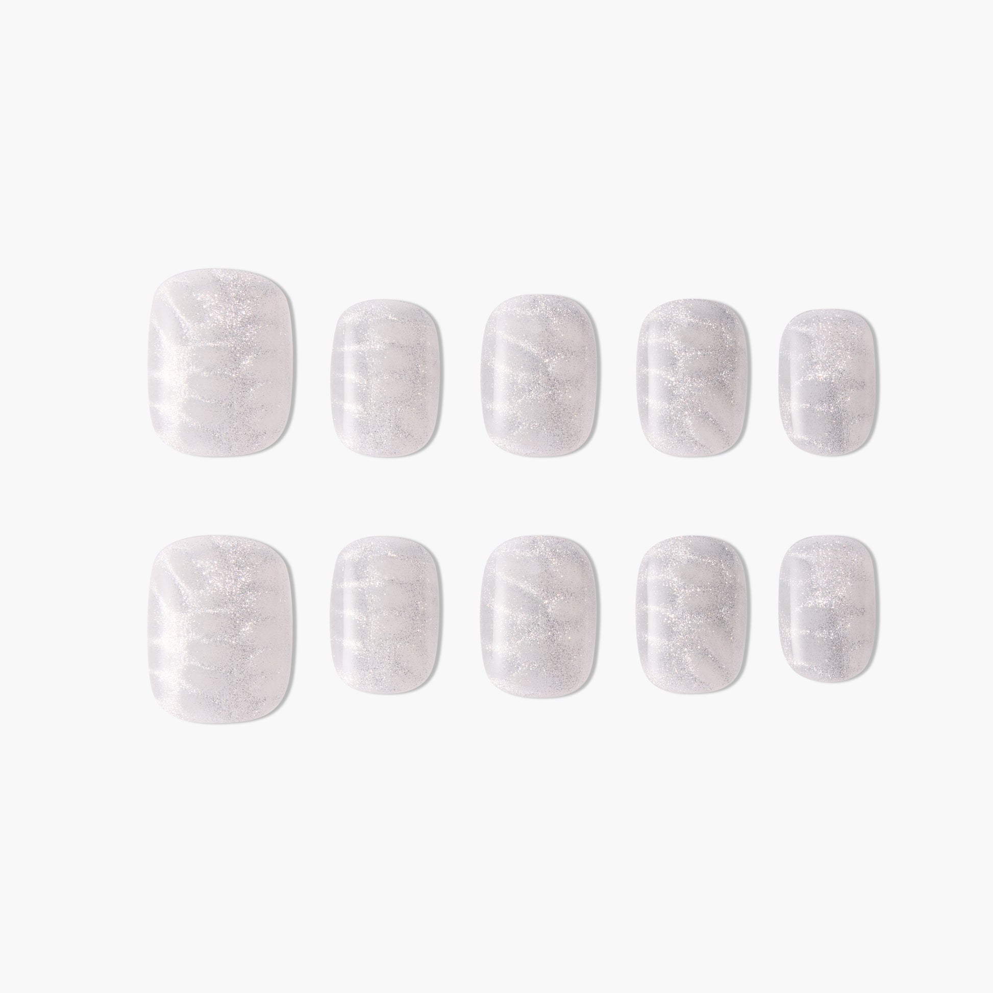 Set of press-on nails with a shimmery white marble design on a plain background