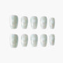 Iridescent press-on nails with white star design and glitter, arranged on white background