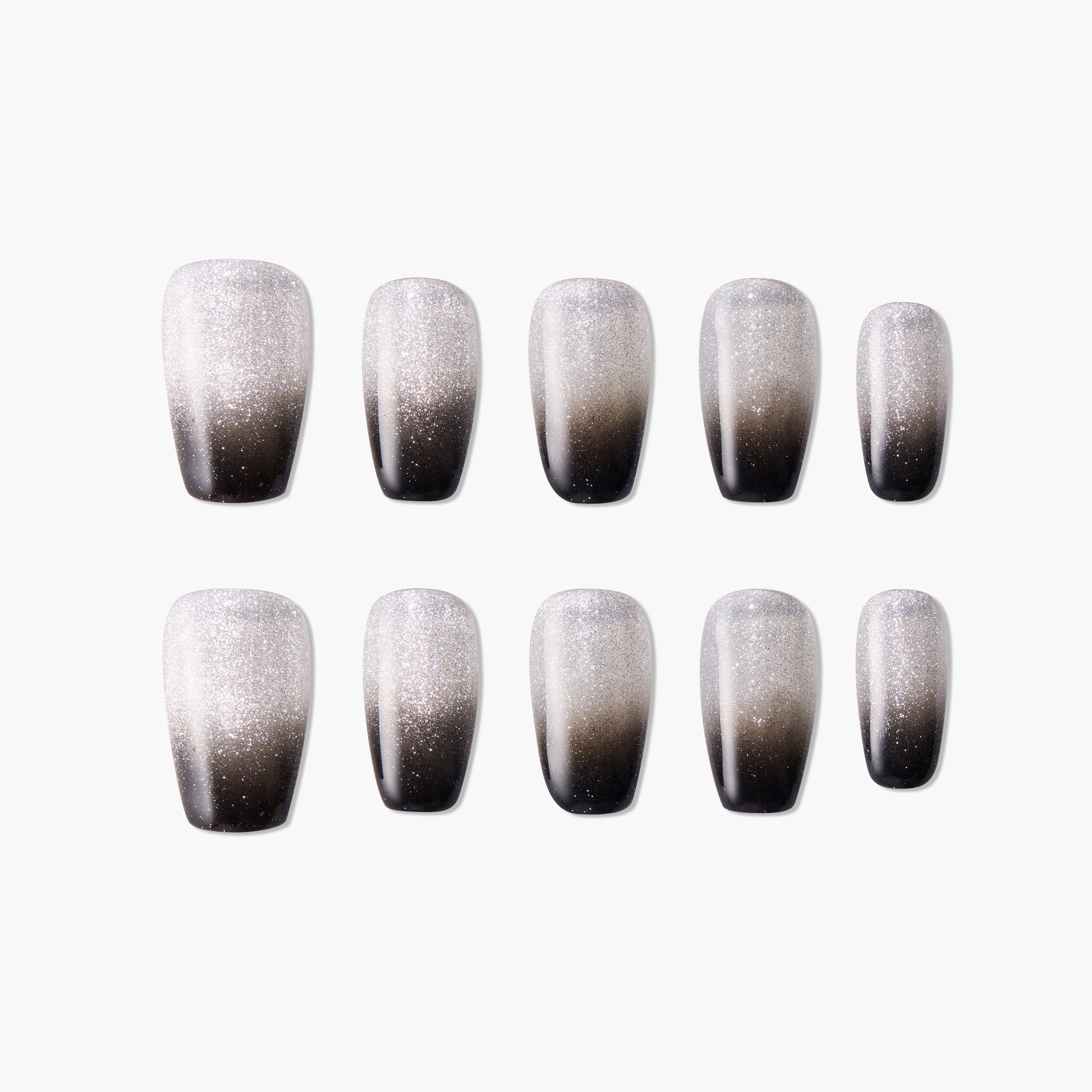 Set of black and silver ombre glitter press-on nails on a white background