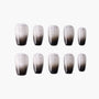 Set of black and silver ombre glitter press-on nails on a white background