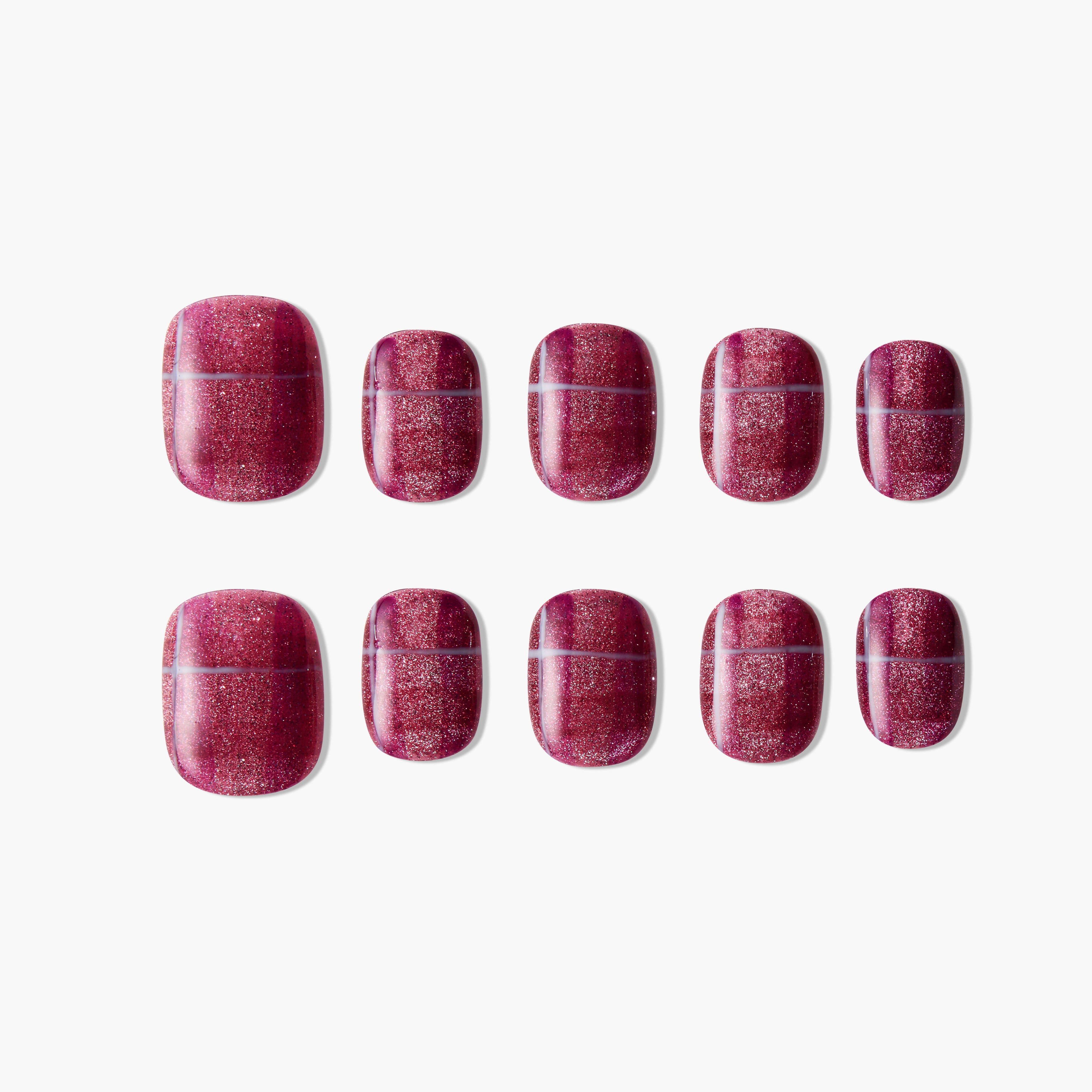 Set of glossy glitter dark red press-on nails displayed on white background