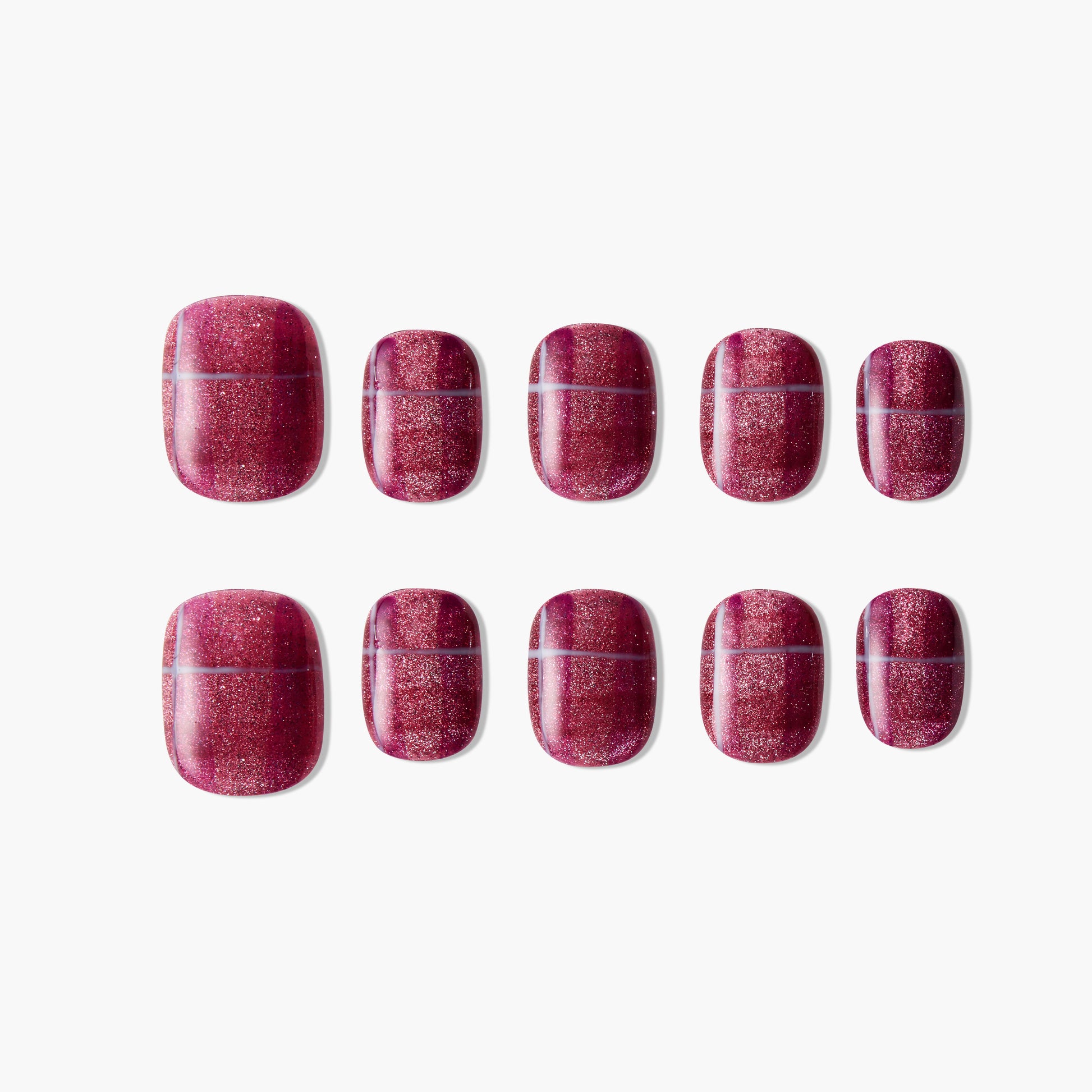 Set of glossy glitter dark red press-on nails displayed on white background