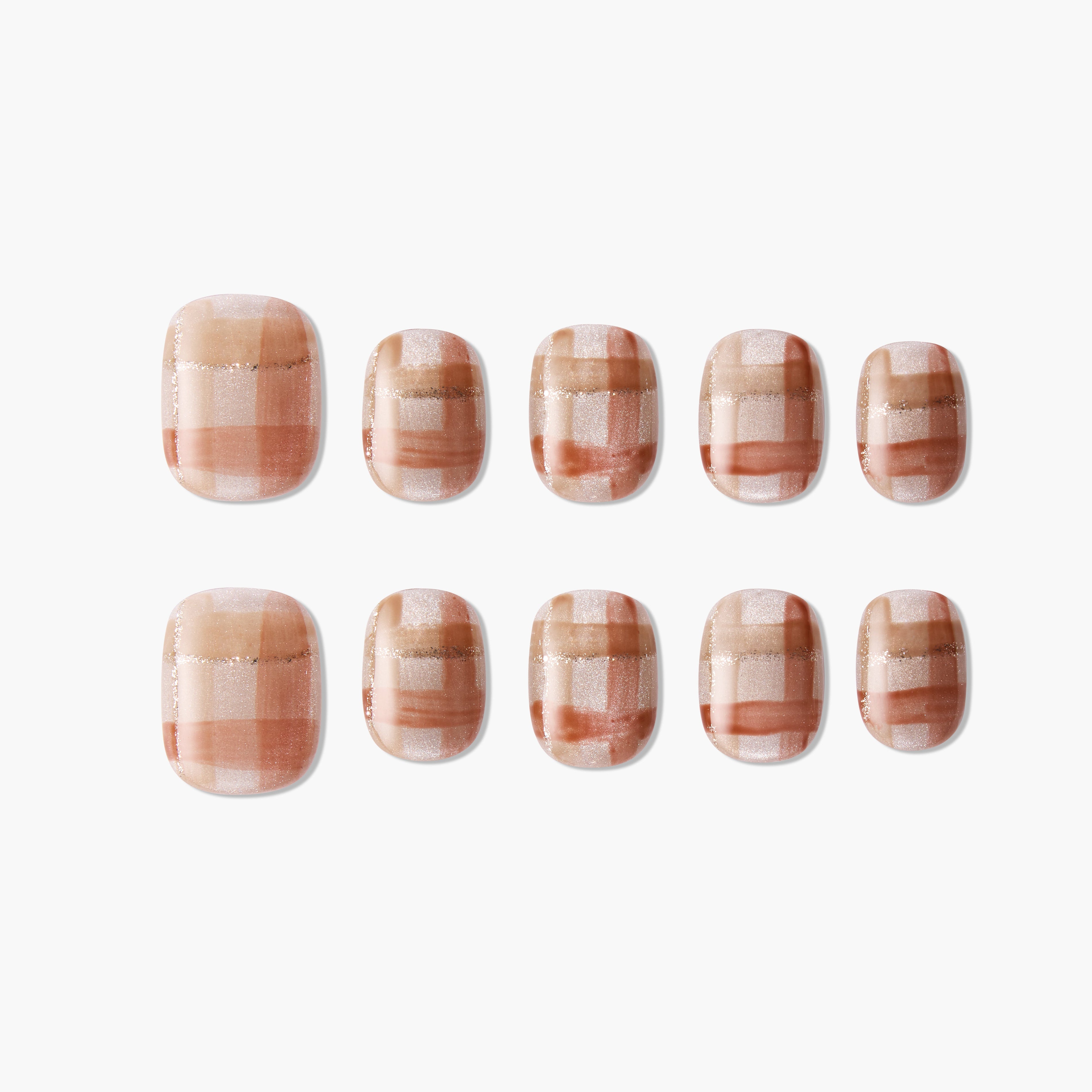 Set of handmade press-on nails with a brown and nude plaid design and glitter accents