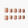 Set of handmade press-on nails with a brown and nude plaid design and glitter accents