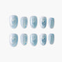 Handmade blue glitter press-on nails set with iridescent shimmer and heart details