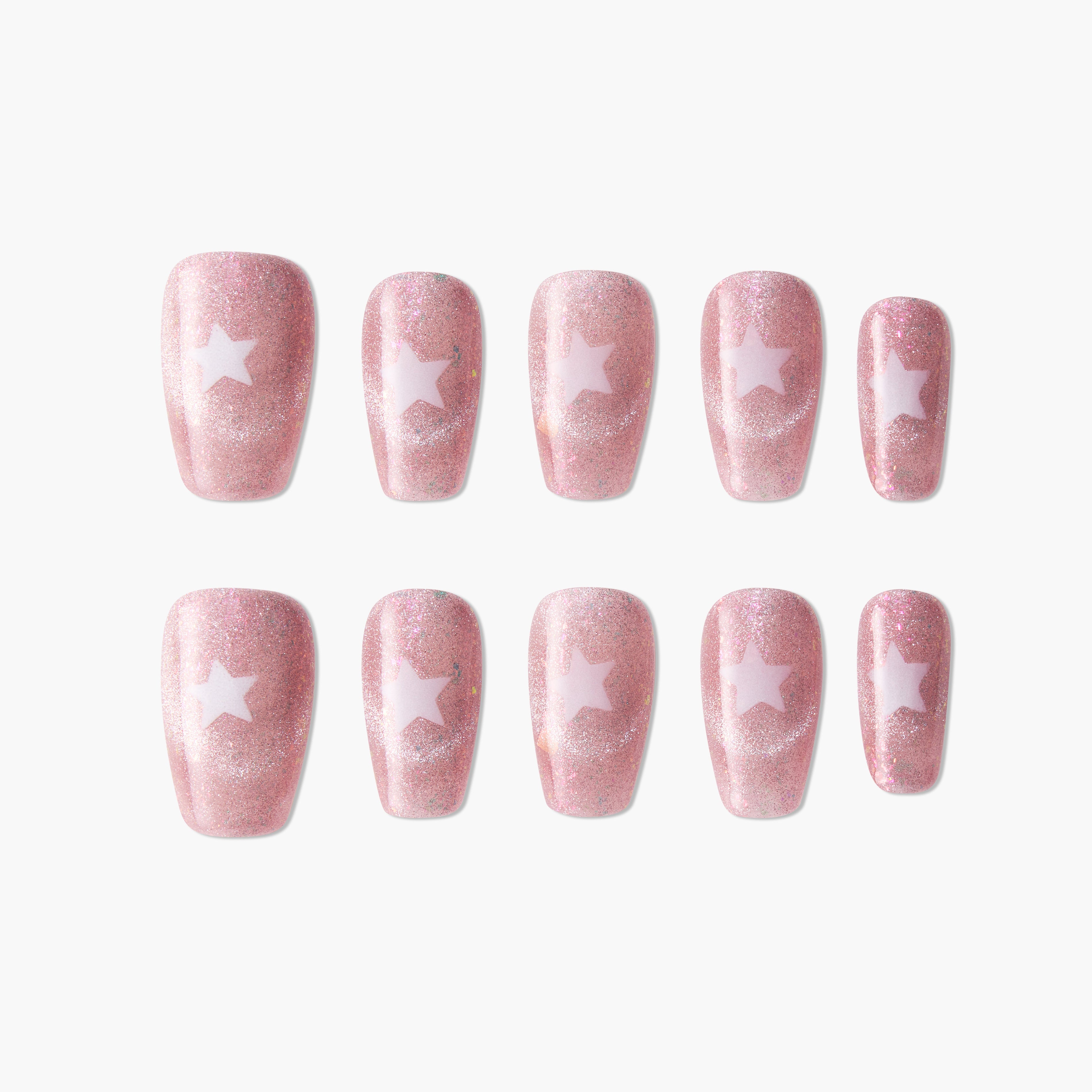 Pink glitter press-on nails with white star design, arranged on a white background.