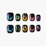 Holographic press-on nails with butterfly accents and iridescent cat eye designs on a white background