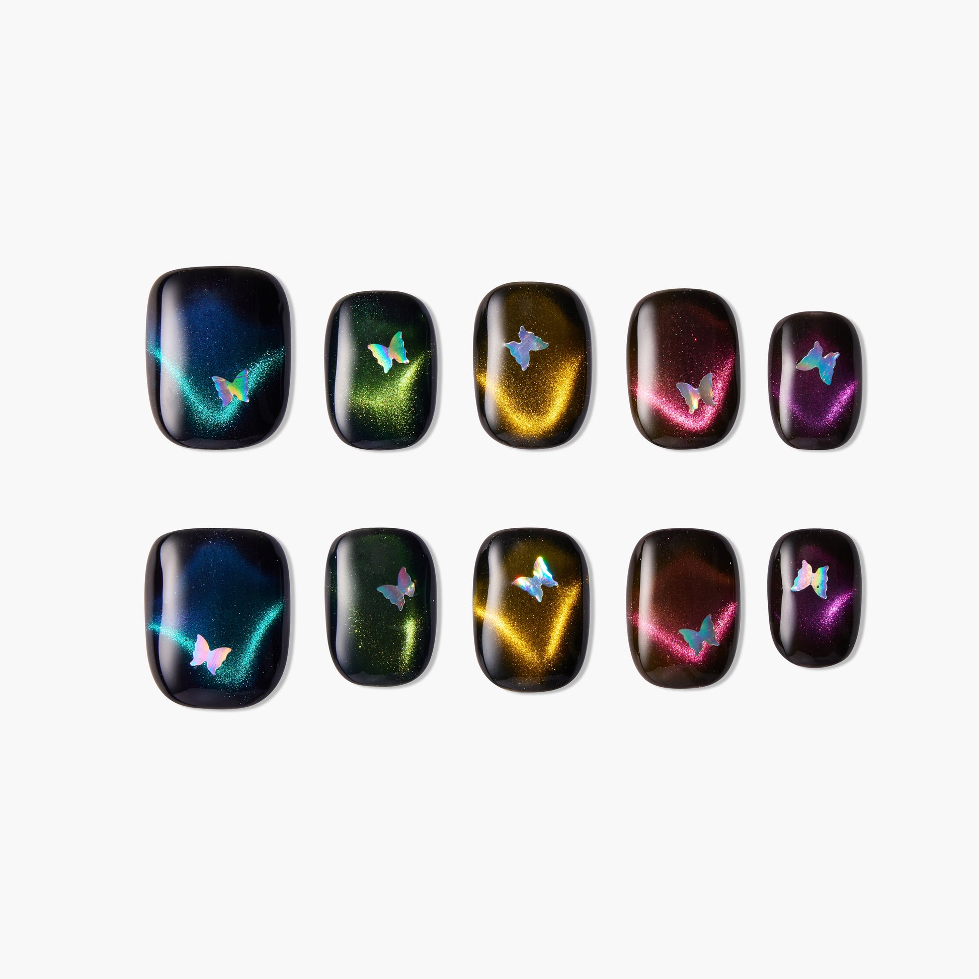 Holographic press-on nails with butterfly accents and iridescent cat eye designs on a white background