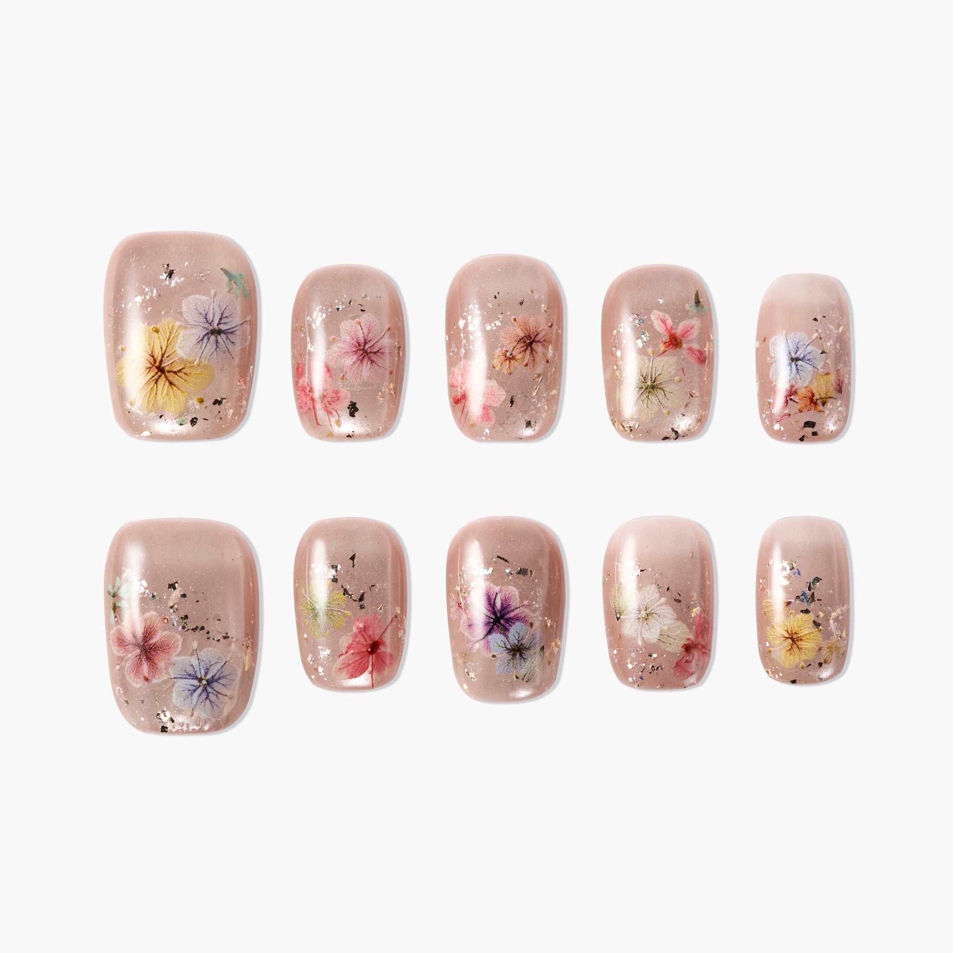 Handmade press-on nails with nude base, colorful dried flower designs, and gold foil accents