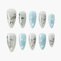 Handmade press-on nails with pastel blue and silver floral designs, featuring 3D accents.