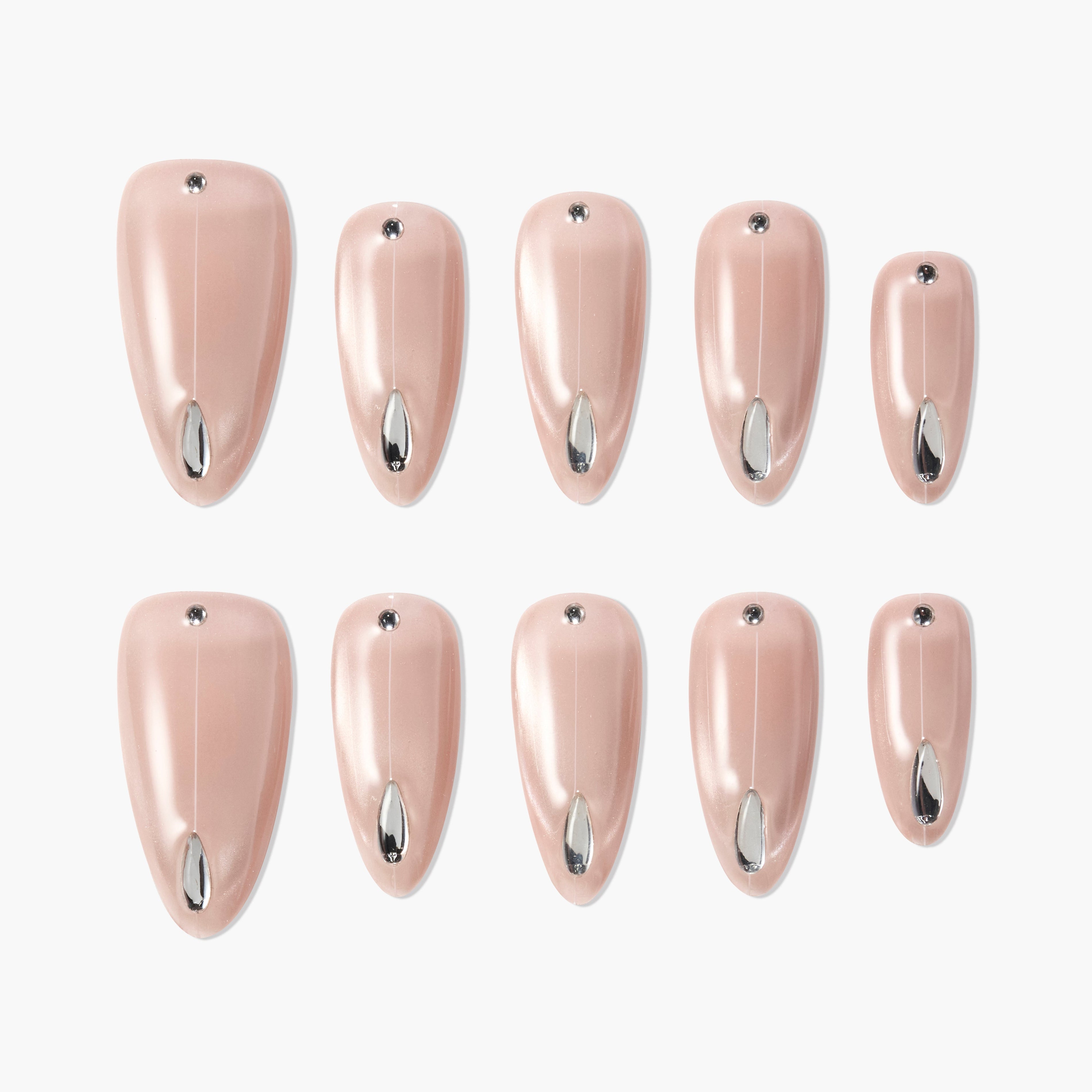 Glossy pink press-on nails with silver metallic accents and small rhinestones, laid out on white.