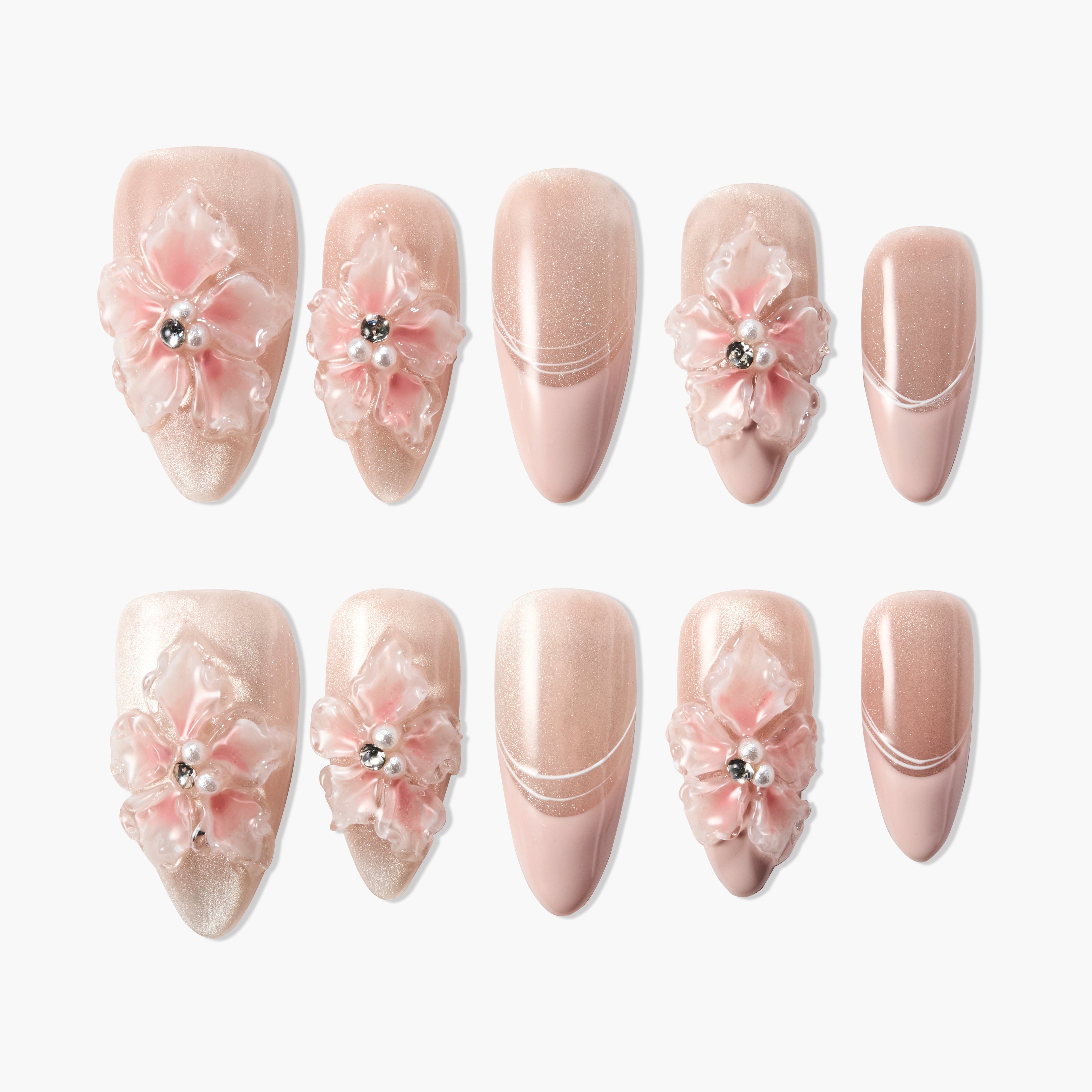 Pink and nude press-on nails with 3D floral accents and rhinestones, elegant nail art set