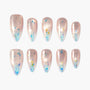 Handmade press-on nails with nude shimmer, blue gradient tips, and iridescent foil accents