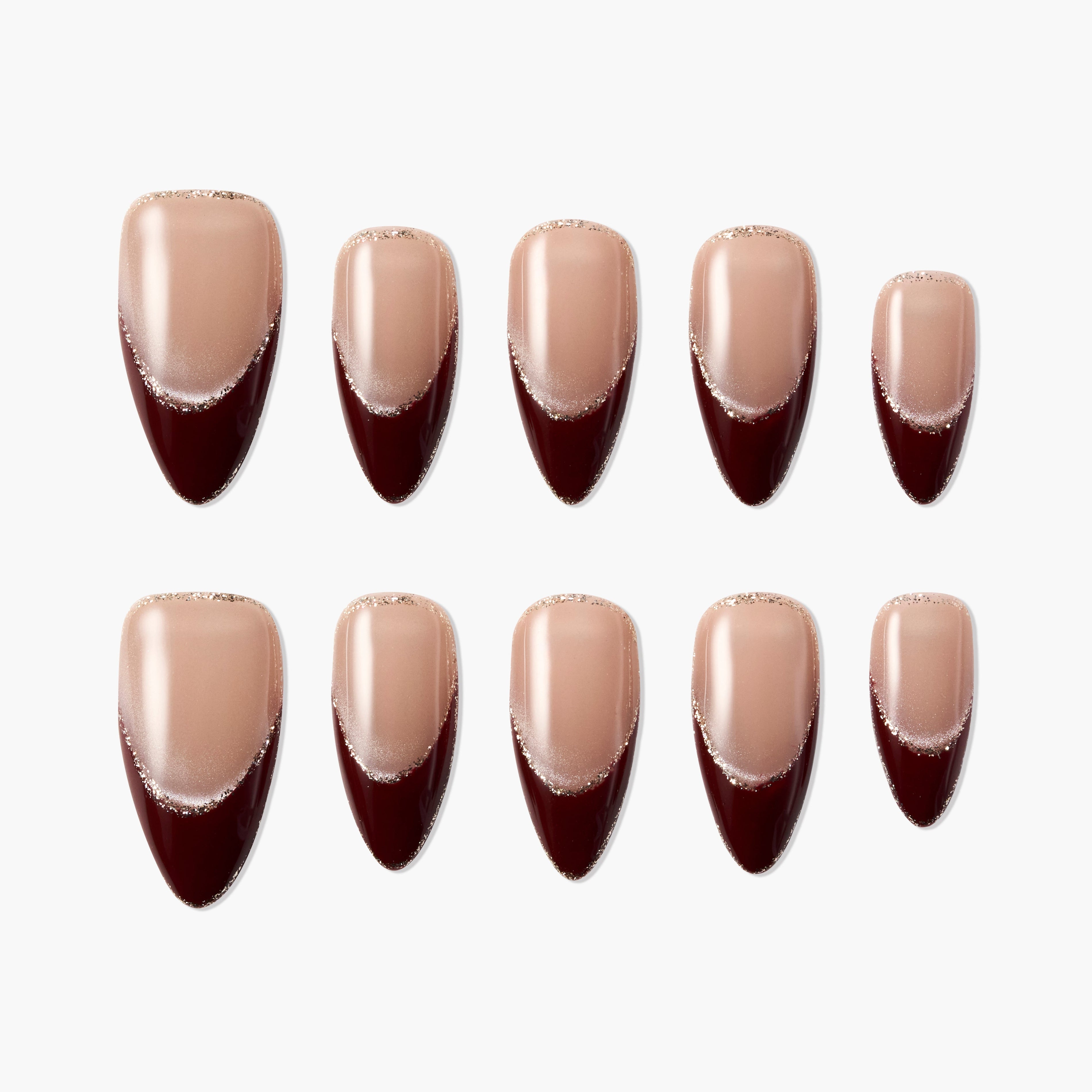 Handmade press-on nails with nude base, burgundy French tips, and subtle glitter accents