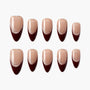 Handmade press-on nails with nude base, burgundy French tips, and subtle glitter accents