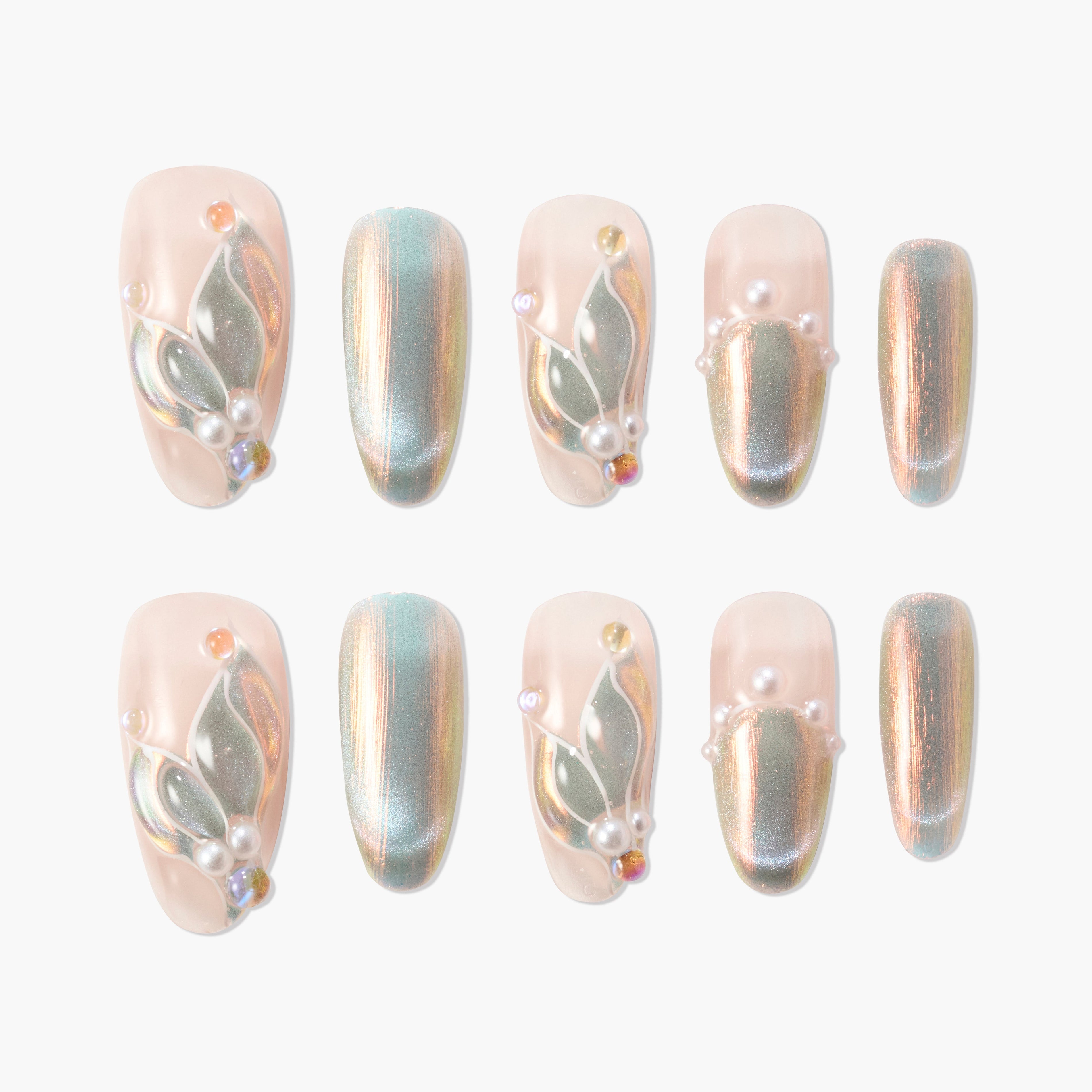 Iridescent press-on nails with pearl and gem accents, featuring delicate floral designs.