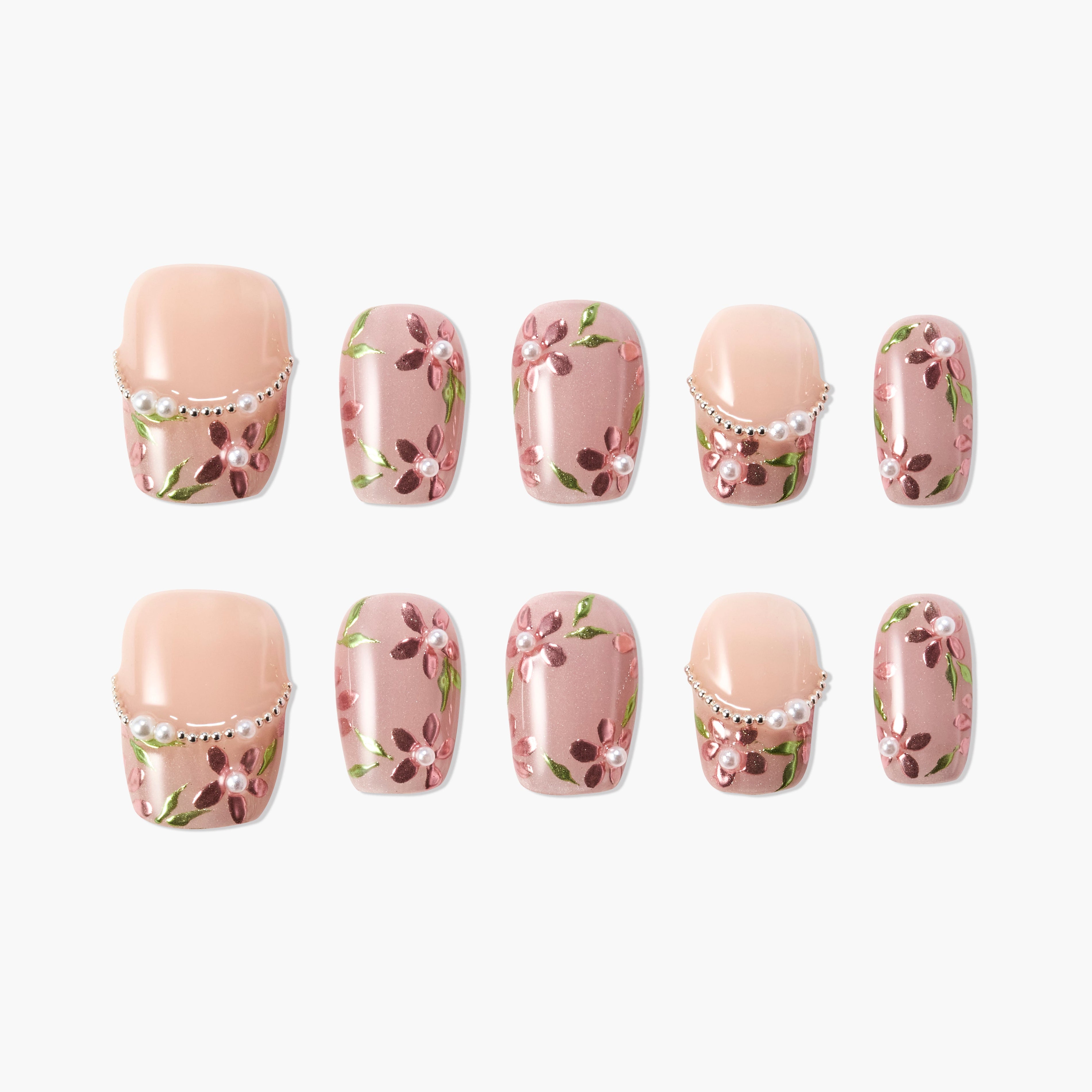 Handmade press-on nails with pink floral design, green leaves, and pearl accents