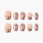 Handmade press-on nails with pink floral design, green leaves, and pearl accents