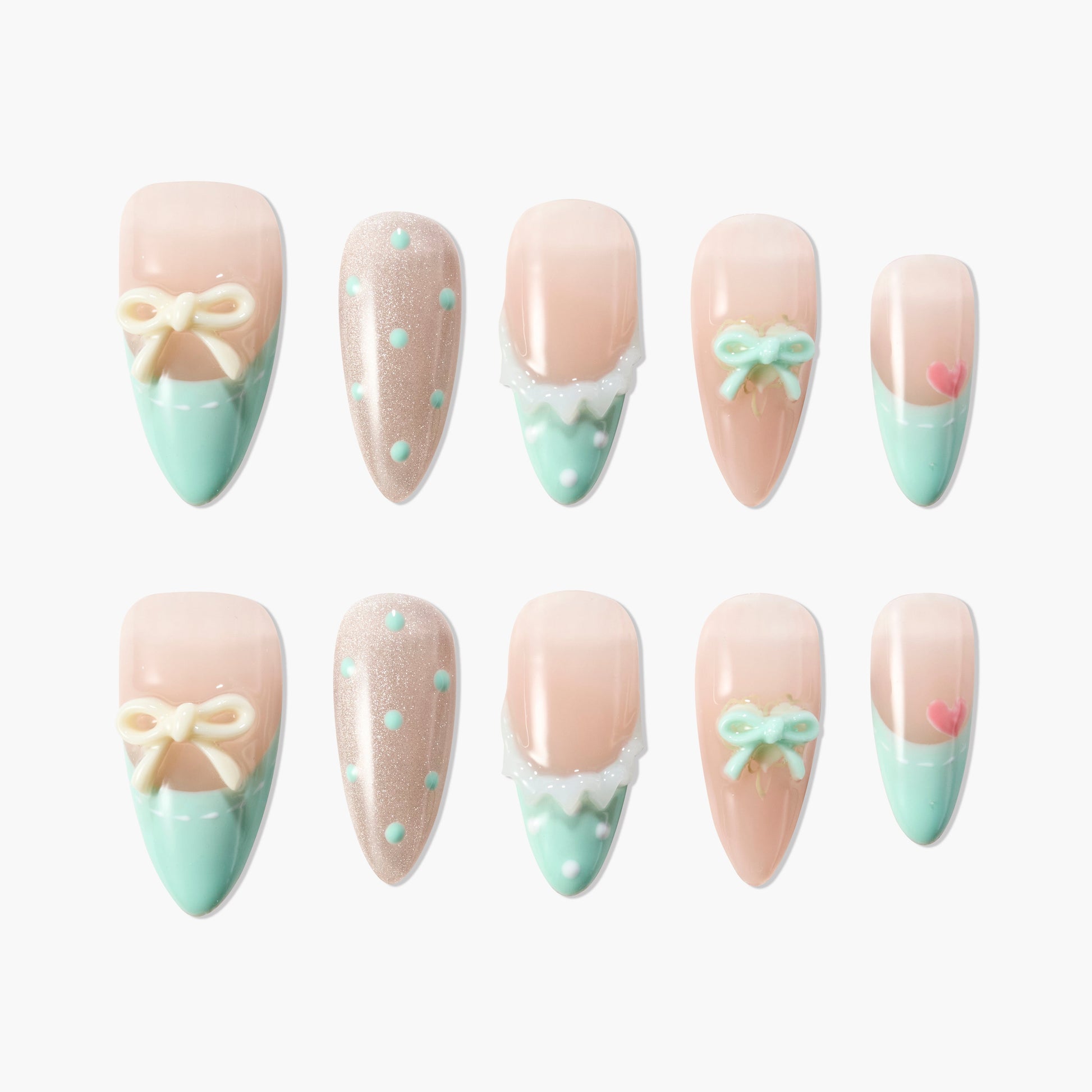 Set of pastel pink and mint green press-on nails with 3D bows, polka dots, and heart designs