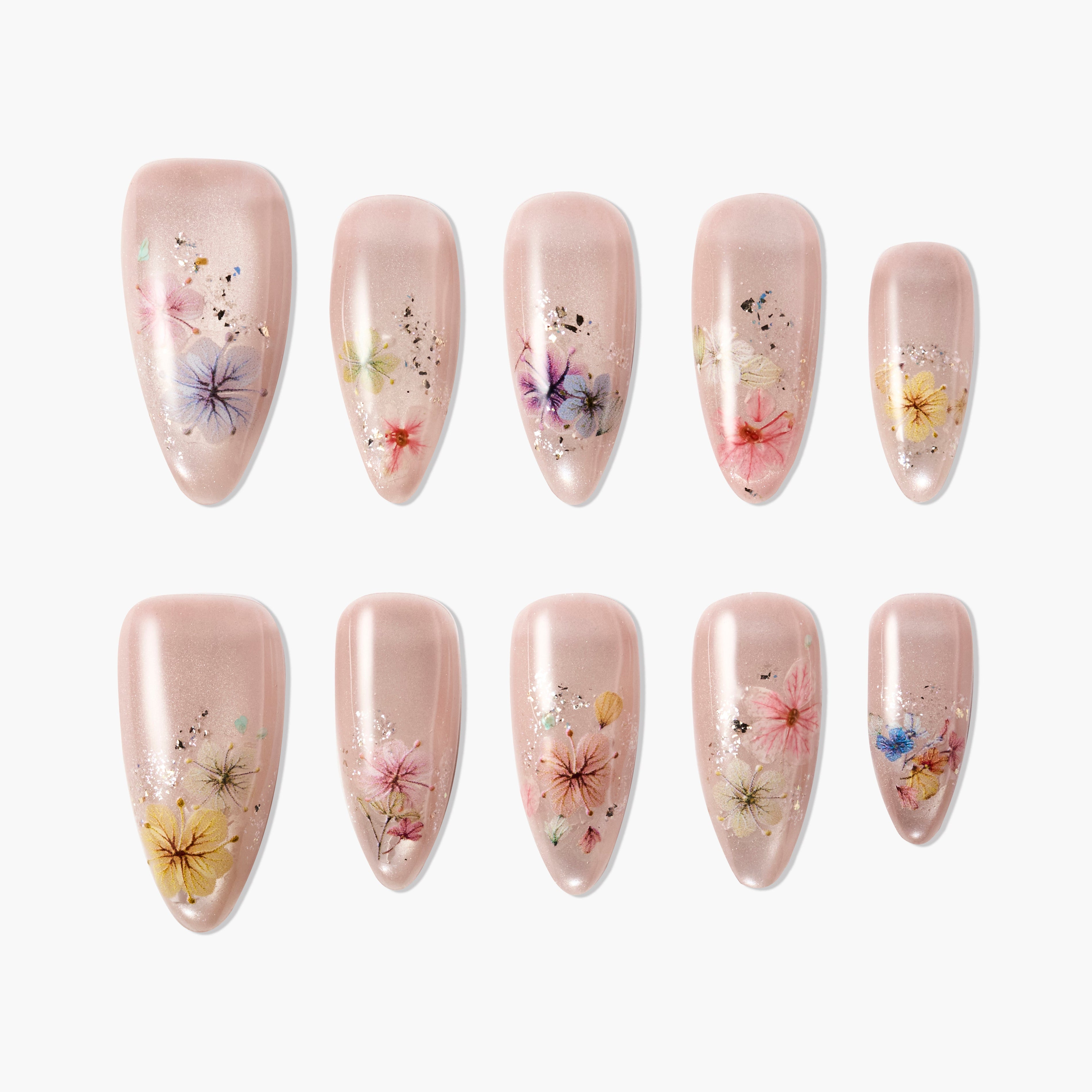 Handmade press-on nails with nude base and colorful dried flower designs, floral nail art set