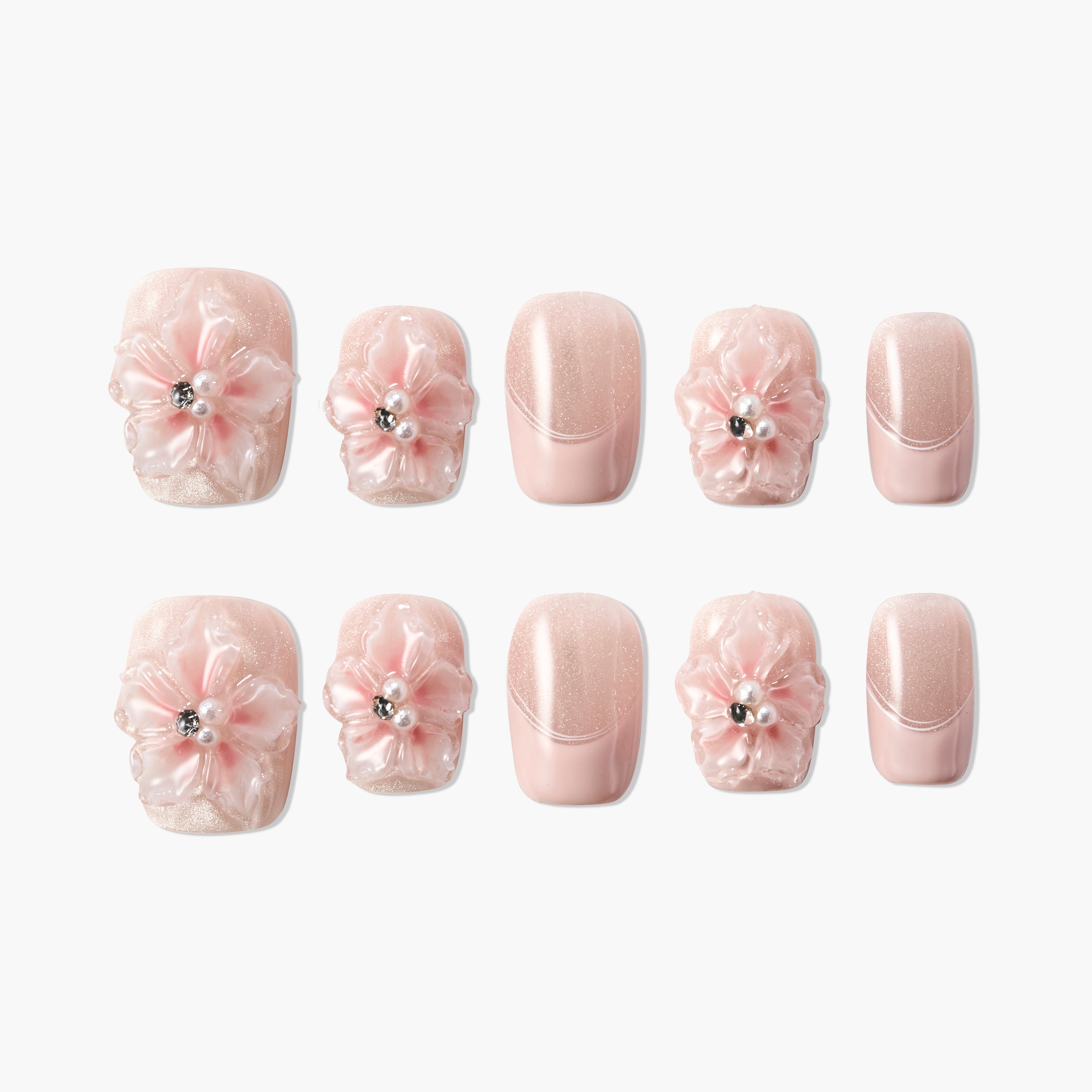Pink glitter handmade press-on nails with 3D floral accents and pearl rhinestones