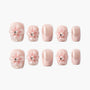 Pink glitter handmade press-on nails with 3D floral accents and pearl rhinestones