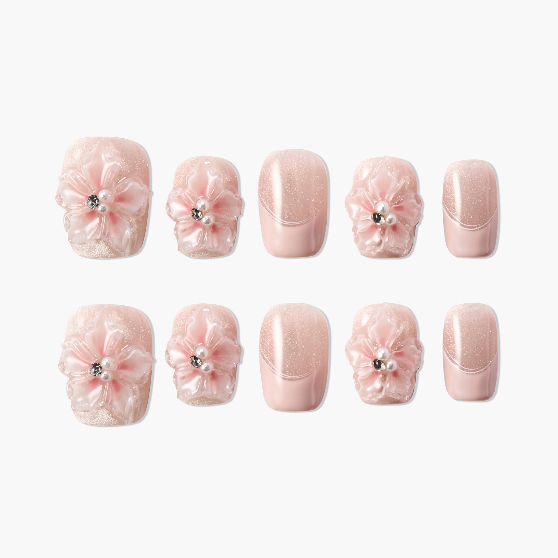 Pink glitter handmade press-on nails with 3D floral accents and pearl rhinestones