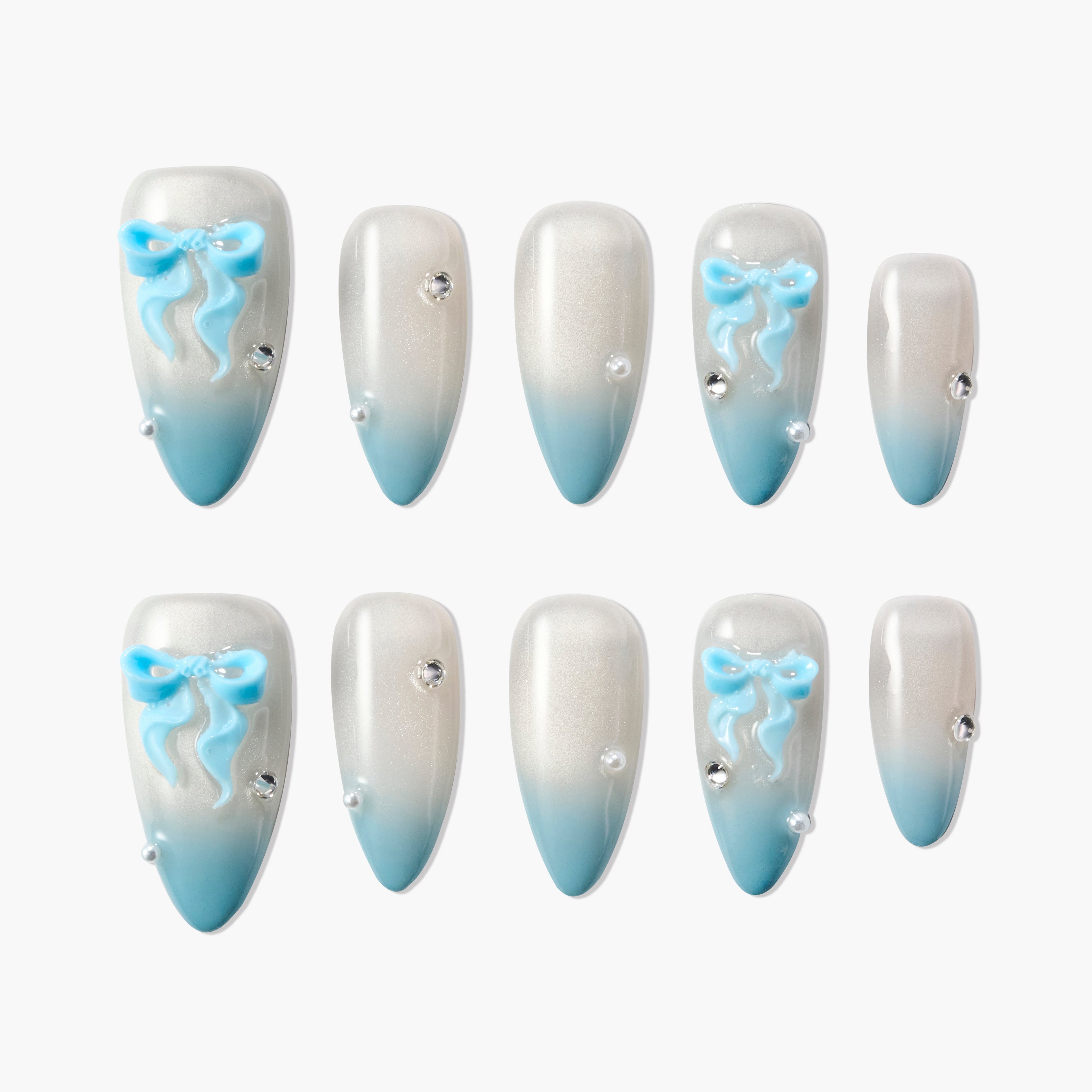 Blue ombre press-on nails with 3D bow and rhinestone accents, elegant and handmade design